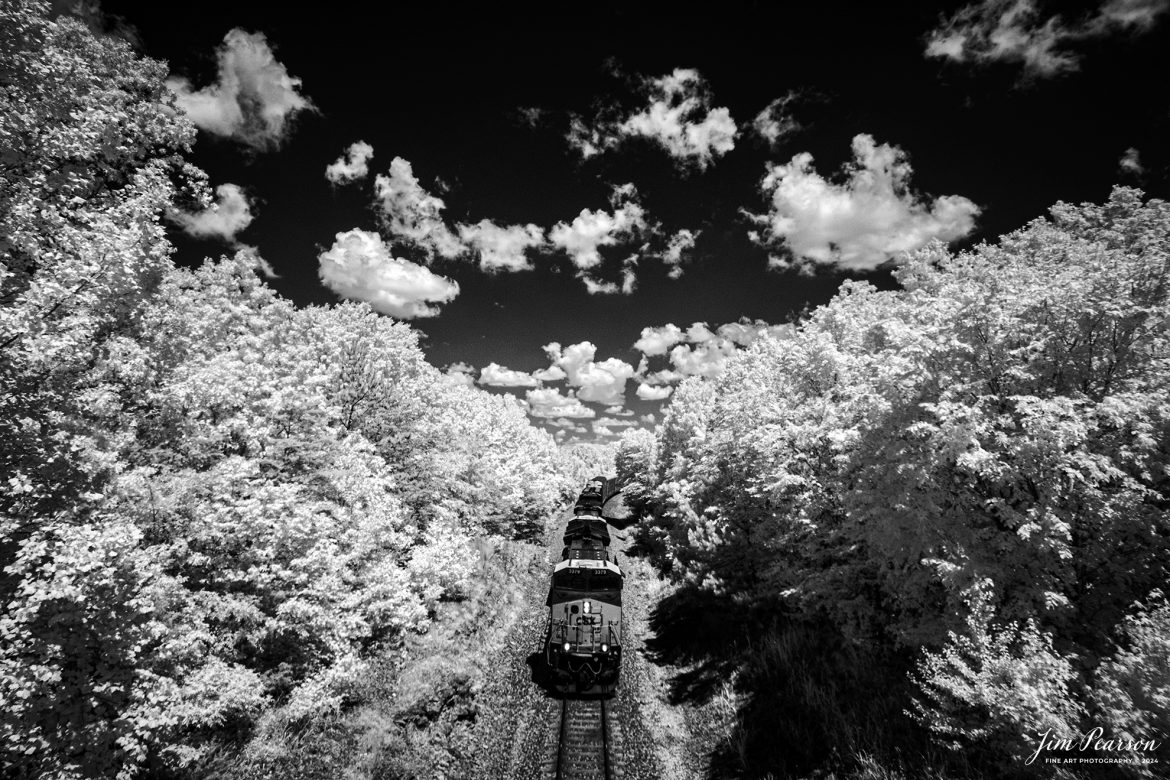 In this week’s Saturday Infrared photo, we catch CSXT 3170 leading CSX I025 south prepare to pass under the overpass at Mannington, Kentucky, on May 30th, 2024, on the CSX Henderson Subdivision.

Tech Info: Fuji XT-1, RAW, Converted to 720nm B&W IR, Nikon 10-24mm @ 13mm, f/5.6, 1/1000., ISO 400.

#trainphotography #railroadphotography #trains #railways #jimpearsonphotography #infraredtrainphotography #infraredphotography #trainphotographer #railroadphotographer #infaredtrainphotography #csxt #intermodal #trending