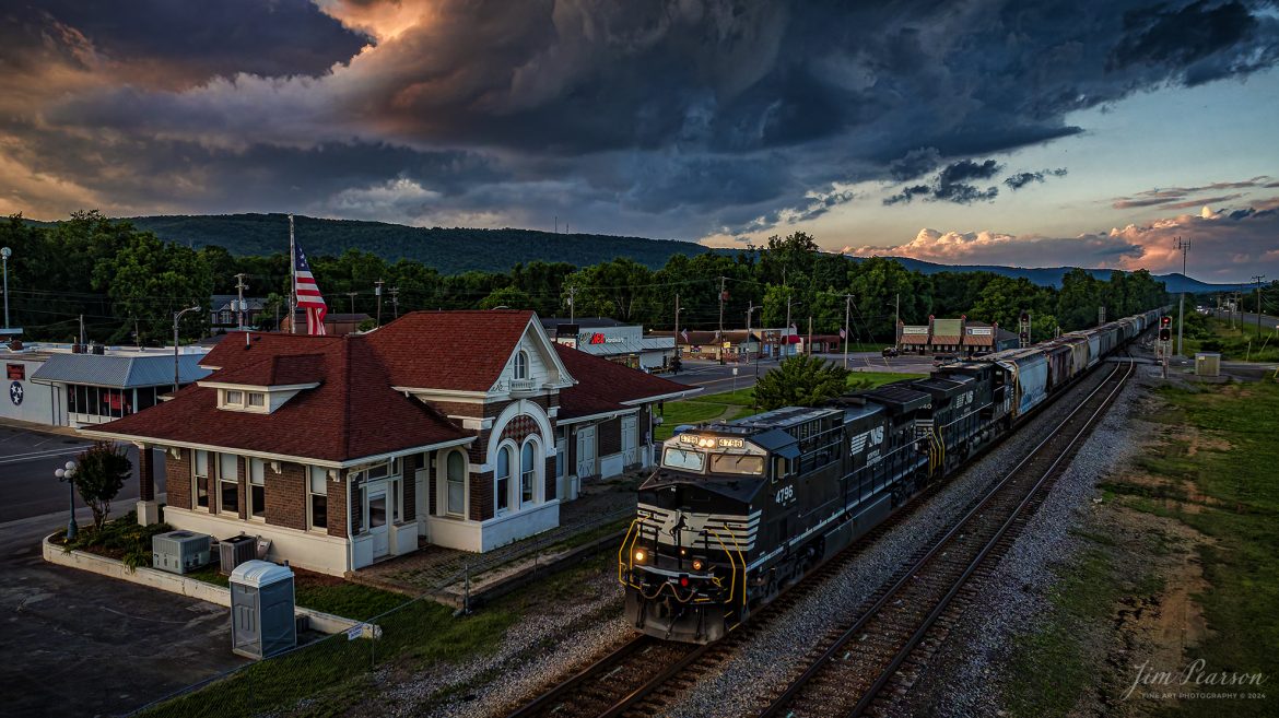 Norfolk Southern 4796 leads 40D south on the NS CNO&TP Third District as they pass the old depot in downtown Spring City, Tennessee as the sun sets and  stormy skies roll through the area, on June 6th, 2024.

According to https://theclio.com website: The restored railroad depot was built In 1900 by the Queen and Crescent Railroad Company that extended out of Cincinnati Ohio built for the purposes of extending travel and commerce to the south.

In addition to it’s function of providing access to the southern areas of the United States, the Depot eventually became a museum that chronicled the story of a group of female rebels dubbed “The Rhea County Spartans.” During the course of the Civil War these Women Served as spies for the Confederate Army. However they were eventually caught and as a result of their actions they were arrested and sent 54 miles to the Market Street in Chattanooga. It was there that they were forced to swear allegiance to the Union before being sent back home on foot.

Today it houses the Spring City History Museum.

Tech Info: DJI Mavic 3 Classic Drone, RAW, 24mm, f/2.8, 1/640, ISO 400.