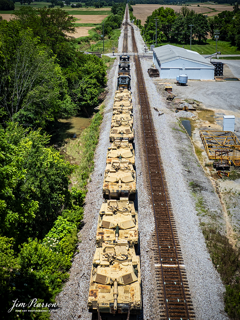 CSX M512 heads north past the siding at Slaughters, Kentucky, on June 13th, 2024, with a string of 30 M1 Tanks in their consist as they head north on the CSX Henderson Subdivision. 

Tech Info: DJI Mavic 3 Classic Drone, RAW, 22mm, f/2.8, 1/2000, ISO 100.

#railroad #railroads #train #trains #bestphoto #railroadengines #picturesoftrains #picturesofrailway #bestphotograph #photographyoftrains #trainphotography #JimPearsonPhotography #trendingphoto #csxt #trainsfromadrone #military