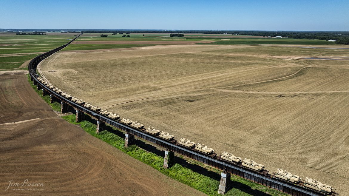 CSX M512 heads north on the viaduct at Rahm, Indiana, on June 13th, 2024, with a string of 30 M1 Tanks in their consist as they head north on the CSX Henderson Subdivision. The viaduct here travels over a flood plain on the Ohio River.

Tech Info: DJI Mavic 3 Classic Drone, RAW, 22mm, f/2.8, 1/2000, ISO 100.

#railroad #railroads #train #trains #bestphoto #railroadengines #picturesoftrains #picturesofrailway #bestphotograph #photographyoftrains #trainphotography #JimPearsonPhotography #trendingphoto #csxt #trainsfromadrone #military