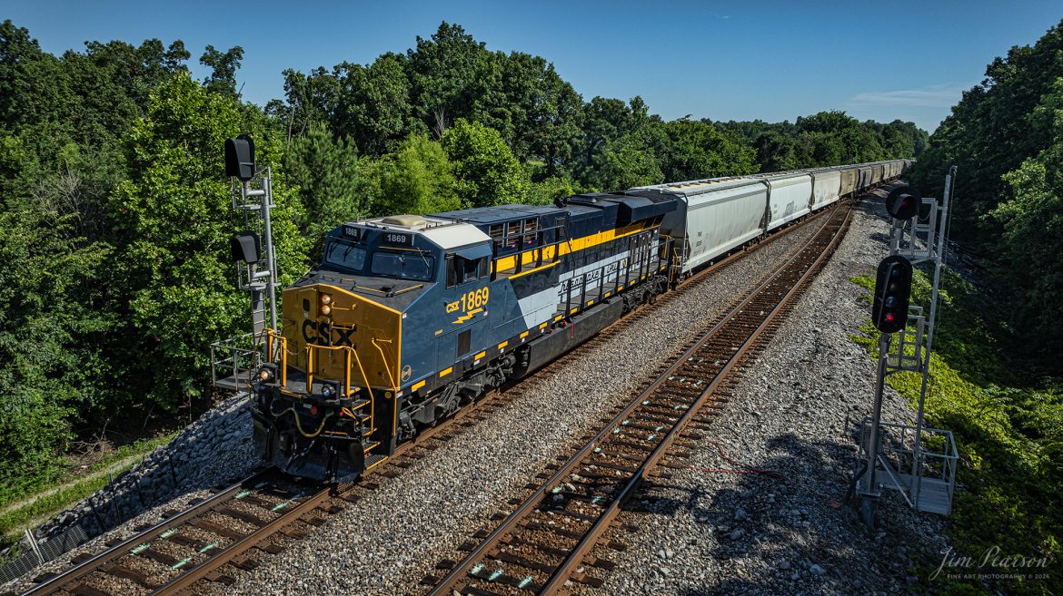 CSX Chesapeake and Ohio Heritage unit 1868 leads M503 as it heads south past the nroth end of the siding at Kelly, Kentucky, on the Henderson Subdivision on the first day of summer, June 20th, 2024.

From a CSX Press Release: A locomotive commemorating the proud history of the Chesapeake and Ohio Railway has entered service as the fifth in the CSX heritage series celebrating the lines that came together to form the modern railroad.

Numbered CSX 1869 in honor of the year the C&O was formed in Virginia from several smaller railroads, the newest heritage locomotive sports a custom paint design that includes today’s CSX colors on the front of the engine and transitions to a paint scheme inspired by 1960s era C&O locomotives on the rear two-thirds.

The C&O Railway was a major line among North American freight and passenger railroads for nearly a century before becoming part of the Chessie System in 1972 and eventually merging into the modern CSX. In 1970, the C&O included more than 5,000 route miles of track stretching from Newport News, Virginia, to Chicago and the Great Lakes.

Tech Info: DJI Mavic 3 Classic Drone, RAW, 22mm, f/2.8, 1/1600, ISO 140.

#railroad #railroads #train #trains #bestphoto #railroadengines #picturesoftrains #picturesofrailway #bestphotograph #photographyoftrains #trainphotography #JimPearsonPhotography #trendingphoto #csxt #trainsfromadrone #csxheritage