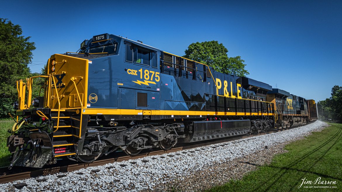 CSX M513 heads southbound with CSX Pittsburgh & Lake Erie Railroad Heritage Unit (P&LE), 1875, leading the way at Mortons Gap, Kentucky on the CSX Henderson Subdivision, on June 24th, 2024. 

According to a CSX Press Release: June 6, 2024 - CSX has released a new heritage locomotive, the P&LE 1875, paying tribute to the storied Pittsburgh & Lake Erie Railroad (P&LE). The 15th in CSX’s heritage locomotive series, this new addition to the company’s fleet not only celebrates the rich history of P&LE but also marks a significant milestone in CSX's ongoing commitment to honoring the legacies of America's historic railroads.

The Pittsburgh & Lake Erie Railroad was established in 1875 with a primary mission of transporting essential industrial materials such as coal, coke, iron ore, limestone, and steel among the bustling industrial hubs of the region. 

“It’s mainline connected Pittsburgh, Pennsylvania with Youngstown, Ohio and Connellsville, Pennsylvania. It did not actually reach Lake Erie until 1976,” explained Tim Music, a carman painter at the CSX Waycross Locomotive Shop where the unit was produced.

Despite its relatively modest route mileage, the P&LE Railroad earned the nickname "Little Giant" due to the enormous volume of heavy tonnage it moved. This impressive capability drew significant attention and by 1887, the P&LE became a subsidiary of the dominant New York Central Railroad. Under this new ownership, the P&LE enjoyed substantial improvements to its tracks and added capacity for passenger services, further enhancing its regional significance.

Over time, P&LE expanded by leasing branches from smaller railroads. These extensions included lines southeast along the Monongahela River through Homestead and McKeesport, and along the Youghiogheny River to Connellsville, where it connected with the Western Maryland Railway.

Tech Info: DJI Mavic 3 Classic Drone, RAW, 22mm, f/2.8, 1/2000, ISO 110.

#railroad #railroads #train, #trains #railway #railway #steamtrains #railtransport #railroadengines #picturesoftrains #picturesofrailways #besttrainphotograph #bestphoto #photographyoftrains #steamtrainphotography #CSXPLEheritageunit #bestsoldpicture #JimPearsonPhotography #csxheritagelocomotive