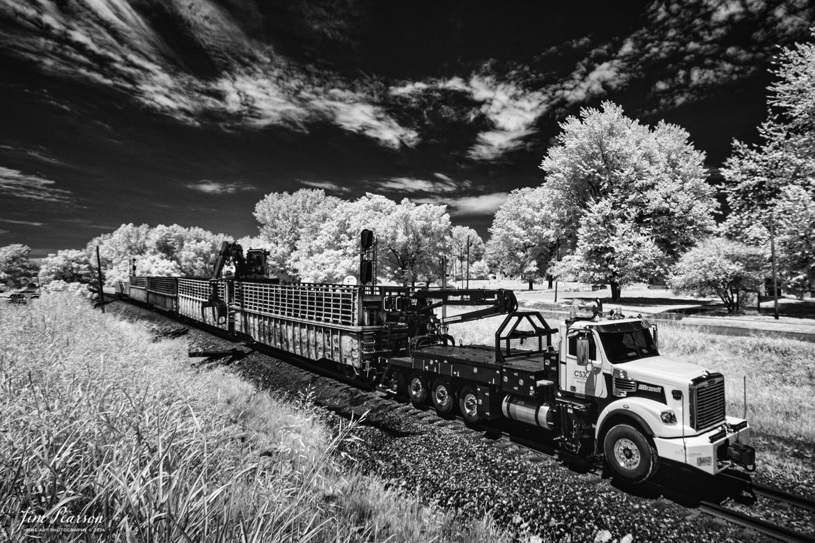 In this week’s Saturday Infrared photo, we catch a CSX Maintenance of Way crew unloading new ties along the right of way as they work their way south at Mortons Gap, Kentucky on June 24th, 2024, on the CSX Henderson Subdivision. For the past few weeks MOW crews have been preparing for a maintenance of way track curfew on the subdivision which from my understanding will start the first part of July.

Tech Info: Fuji XT-1, RAW, Converted to 720nm B&W IR, Nikon 10-24mm @ 11mm, f/5.6, 1/320, ISO 200.

#trainphotography #railroadphotography #trains #railways #jimpearsonphotography #infraredtrainphotography #infraredphotography #trainphotographer #railroadphotographer #infaredtrainphotography #csxt #mow #trending