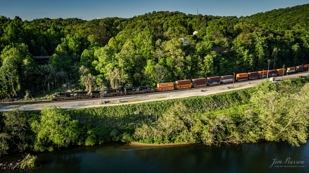 Norfolk Southern 229  runs along the Emory River at Harriman, TN, on the NS CNO&TP (Rathole) as it heads north on April 28th, 2024.

According to American-rails.com, It used to be called the Rathole Division when it was the Southern Railway and is often remembered as a road with relatively flat and tangent main lines due to the region in which it operated. However, the system did feature its share of steep, circuitous main lines such as Saluda Grade in western North Carolina and its famed “Rathole Division” through Kentucky and Tennessee that reached as far north as Cincinnati.

Technically, this stretch of the Southern main line was known as the 2nd District of subsidiary Cincinnati, New Orleans & Texas Pacific (CNO&TP), which was plagued for years by numerous tunnels resulting in its famous nickname by the crews which operated over it.

Over the years the Southern worked to daylight or bypass these obstacles as the route saw significant freight tonnage, a task finally completed during the 1960s. Today, the Rathole remains an important artery in Norfolk Southern’s vast network.

Tech Info: DJI Mavic 3 Classic Drone, RAW, 22mm, f/2.8, 1/1250, ISO 220.

#railroad #railroads #train #trains #bestphoto #railroadengines #picturesoftrains #picturesofrailway #bestphotograph #photographyoftrains #trainphotography #JimPearsonPhotography #nscnotpsubdivision #norfolksouthern #trendingphoto