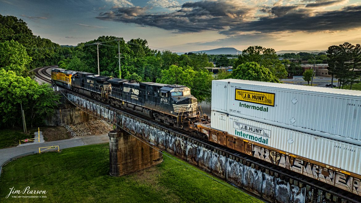 Union Pacific 5954, sporting their new paint scheme, leads a southbound Norfolk Southern Intermodal off the Tennbridge, over the Tennessee River at sunset, on the CNO&TP Third District, at East Chattanooga, TN. 

According to Wikipedia: Tenbridge is a vertical-lift railroad bridge over the Tennessee River in Chattanooga, Tennessee. It has a main span of 310 feet (94 m).

The original span was a swing span with a center pivot that was originally built in ca. 1879/1880. It was replaced by a vertical lift span in 1917, but the lift towers and machinery were not installed until 1920. It remains a very busy crossing on the Cincinnati, New Orleans and Texas Pacific Railway, a major subsidiary of the Norfolk Southern Railway. The bridge carries two mainline tracks across the river.

Tech Info: DJI Mavic 3 Classic Drone, RAW, 24mm, f/2.8, 1/1000, ISO 290.

#railroad #railroads #train #trains #bestphoto #railroadengines #picturesoftrains #picturesofrailway #bestphotograph #photographyoftrains #trainphotography #JimPearsonPhotography #trendingphoto