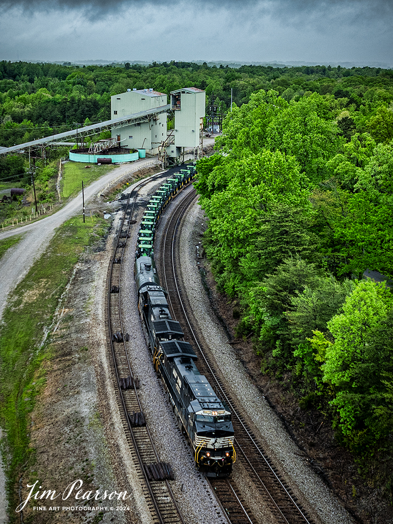 Norfolk Southern 4413 and 9783 lead 29F as they pass the old mine loadout at Revelo outside Sterns, Kentucky with their train, which includes 10 flats loaded with John Deere Tractors behind the power, as they head south on NS CNO&TP (Rathole) Subdivision, on April 30th, 2024. stormy skies.

Tech Info: DJI Mavic 3 Classic Drone, RAW, 24mm, f/2.8, 1/640, ISO 120.

#trainphotography #railroadphotography #trains #railways #dronephotography #trainphotographer #railroadphotographer #jimpearsonphotography #trains #bnsf #mavic3classic #drones #trainsfromtheair #trainsfromadrone #NorfolkSouthern #KentuckyTrains #CNOTP