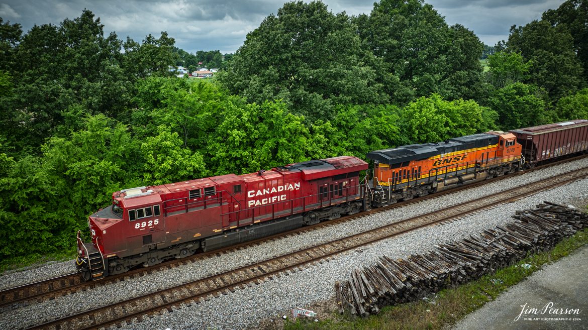 Canadian Pacific 8925 and BNSF 6749 lead CSX B647, a loaded ethanol train, headed southbound at Sebree, Kentucky on May 25th, 2024, on the CSX Henderson Subdivision.

Tech Info: DJI Mavic 3 Classic Drone, RAW, 22mm, f/8, 1/1000, ISO 140.

#trainphotography #railroadphotography #trains #railways #jimpearsonphotography #trainphotographer #railroadphotographer #dronephoto #trainsfromadrone #CSX