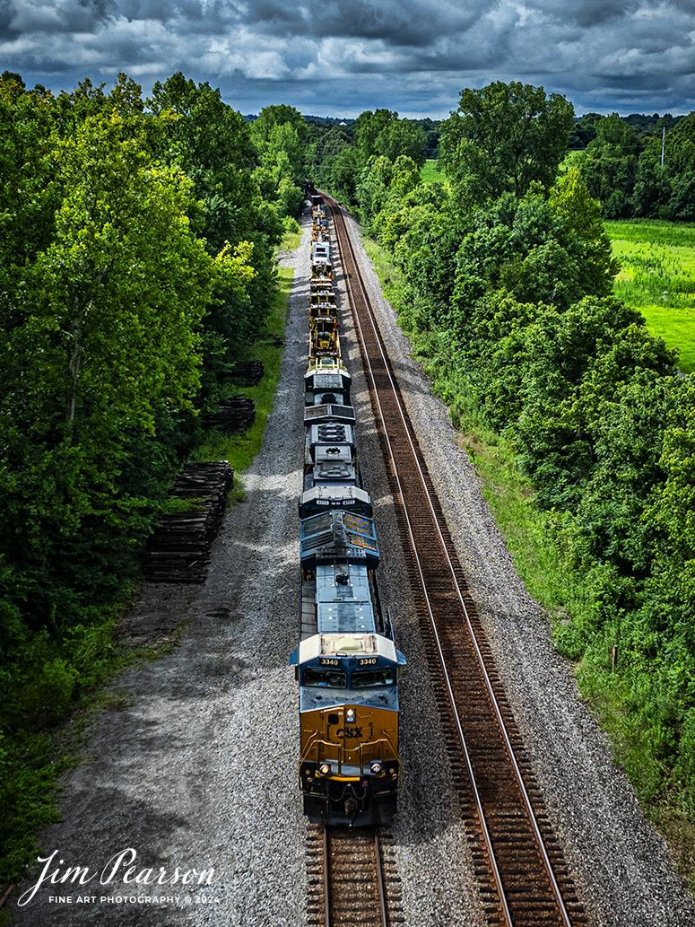 CSX G366 pulls northbound approaching Anaconda at Robards, Kentucky on July 5th, 2024, on the CSX Henderson Subdivision. G366 is normally just an empty grain train, here it was hauling a long string of maintenance of way equipment which will be used in an upcoming CSX work curfew that is scheduled to begin on the subdivision in the next week or so. 

Tech Info: DJI Mavic 3 Classic Drone, RAW, 22mm, f/2.8, 1/2500, ISO 150.

#railroad #railroads #train #trains #bestphoto #railroadengines #picturesoftrains #picturesofrailway #bestphotograph #photographyoftrains #trainphotography #JimPearsonPhotography