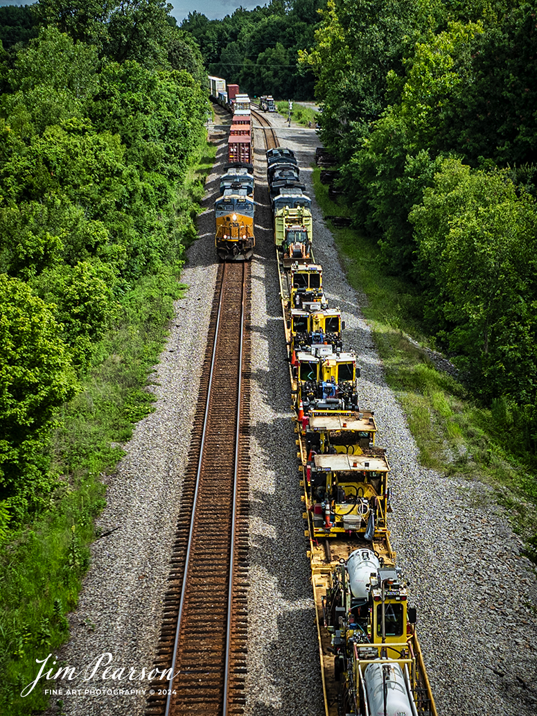 CSX I025 meets G366 at Anaconda, just north of Sebree, Kentucky as it heads south on July 5th, 2024, on the CSX Henderson Subdivision. G366 is normally just an empty grain train, but today it was hauling a long string of maintenance of way equipment which will be used in an upcoming CSX work curfew that is scheduled to begin on the subdivision in the next week or so. 

Tech Info: DJI Mavic 3 Classic Drone, RAW, 22mm, f/2.8, 1/1600, ISO 110.

#railroad #railroads #train #trains #bestphoto #railroadengines #picturesoftrains #picturesofrailway #bestphotograph #photographyoftrains #trainphotography #JimPearsonPhotography #trendingphoto #csxt #trainsfromadrone #csxoperationlifesaver