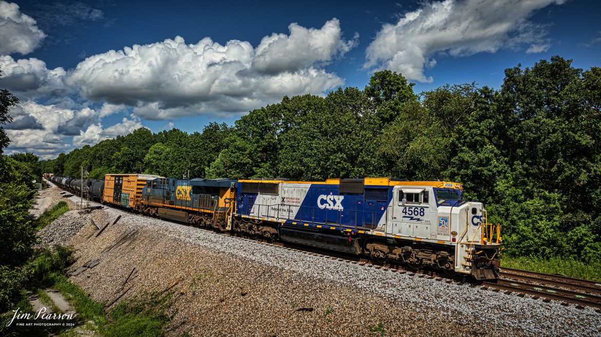 CSXT 4568, 50th Anniversary Operation Lifesaver locomotive, pulls a heavy M647 mixed freight as it passes the north end of Kelly, Ky on July 7th, 2024, on the CSX Henderson Subdivision.

According to a CSX press release: CSX unveiled a new Operation Lifesaver rail safety commemorative locomotive in September of 2022, and it was painted at the railroads locomotive shop in Huntington, West Virginia. The CSXT 4568 engine will travel the company’s rail network as a visual reminder for the public to be safe at highway-rail grade crossings and near railroad tracks.

Tech Info: DJI Mavic 3 Classic Drone, RAW, 22mm, f/2.8, 1/3200, ISO 110.

#railroad #railroads #train #trains #bestphoto #railroadengines #picturesoftrains #picturesofrailway #bestphotograph #photographyoftrains #trainphotography #JimPearsonPhotography #trendingphoto #csxt #trainsfromadrone #csxoperationlifesaver