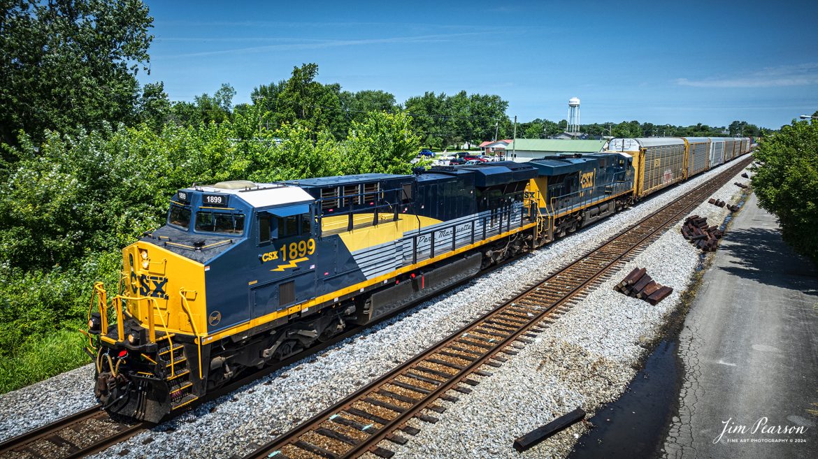 CSX I025 heads southbound with CSX Pere Marquette Heritage Unit 1899, leading the way along the CSX Henderson Subdivision, as they pass through Crofton, Kentucky, on July 18th, 2024. 

According to a CSX Press Release: May 1, 2024 - CSX has introduced the latest addition in its heritage locomotive series, paying homage to the rich history of the Pere Marquette Railroad. This new unit showcases the Pere Marquette's legacy, dating back to its inception on November 1, 1899.
 
The Pere Marquette Railroad, operating in the Great Lakes region of the United States and parts of southern Ontario, Canada, derived its name from Jacques Marquette, a notable French Jesuit missionary credited with founding Michigan's first European settlement in Sault Ste Marie. After years of operation, the company merged with the Chesapeake and Ohio Railway (C&O) on June 6, 1947, eventually becoming part of the renowned CSX network.
 
The design of the Pere Marquette heritage locomotive was meticulously crafted by employees at the CSX Waycross Locomotive Shop. According to CSX Carman Painter Eric Lee, “We had to measure each stripe precisely and position the words just right to ensure it captured the look of the original design. It took us about four days just to lay out the stripes before we could begin painting.”
 
A fascinating tidbit related to the history of Pere Marquette is its cameo in the 2004 film "The Polar Express." The steam locomotive Pere Marquette 1225 served as the inspiration for the train depicted in the movie, with audio recordings of the actual locomotive in operation featured in the film. Interestingly, the locomotive had been donated to Michigan State University and was exhibited near the university's football stadium. The author of "The Polar Express" book drew inspiration from seeing this locomotive on display during childhood, solidifying its place in popular culture.
 
CSX's dedication to honoring the history and significance of the Pere Marquette Railroad through this new locomotive underscores the company's commitment to preserving and celebrating the heritage of American railroads. Keep an eye out as this remarkable piece of history moves across the CSX network, bridging the past with the present.

Tech Info: DJI Mavic 3 Classic Drone, RAW, 22mm, f/2.8, 1/1600, ISO 100.

#railroad #railroads #train, #trains #railway #railway #steamtrains #railtransport #railroadengines #picturesoftrains #picturesofrailways #besttrainphotograph #bestphoto #photographyoftrains #steamtrainphotography #CSXPereMarquetteheritageunit #bestsoldpicture #JimPearsonPhotography #csxheritagelocomotive