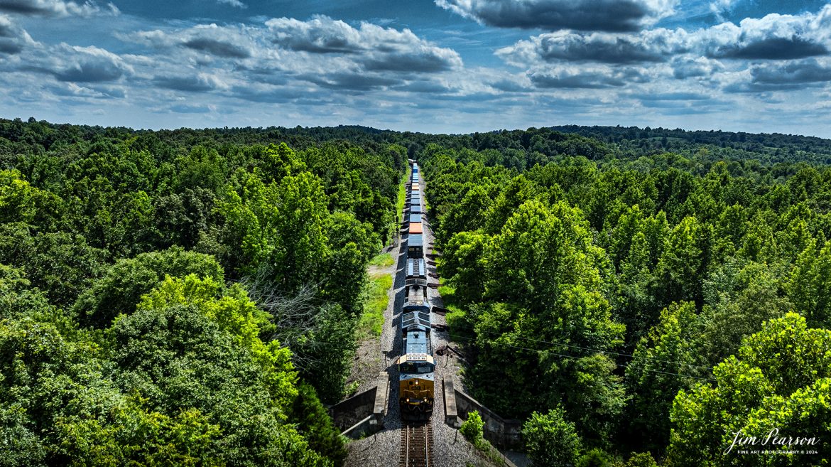 CSX I026 passes over old Madisonville Road as it heads south through the Kentucky countryside on a beautiful summer afternoon, between Crofton and Nortonville, Ky, on July 19th, 2024, on the CSX Henderson Subdivision.

Tech Info: DJI Mavic 3 Classic Drone, RAW, 22mm, f/2.8, 1/3200, ISO 140.

#railroad #railroads #train #trains #bestphoto #railroadengines #picturesoftrains #picturesofrailway #bestphotograph #photographyoftrains #trainphotography #JimPearsonPhotography #trendingphoto #csxt #trainsfromadrone