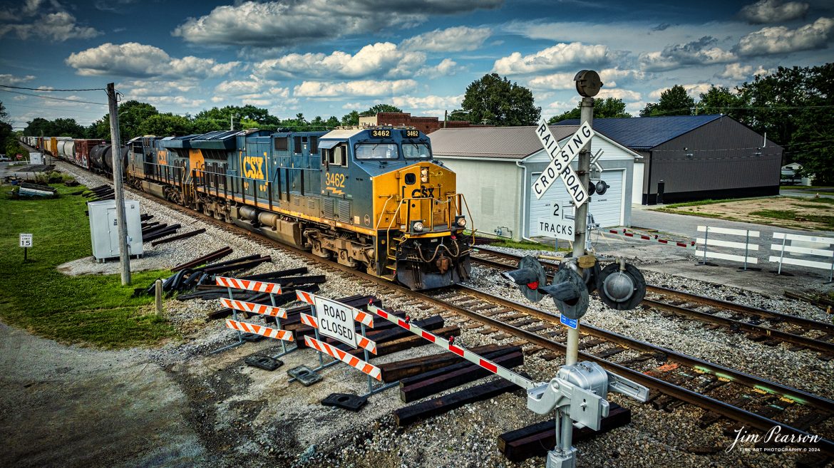 CSX M647 heads southbound through a crossing undergoing refurbishing, with CSXT 3462 leading the way, on the CSX Henderson Subdivision, on July 19th, 2024 at Crofton, Kentucky. 

Tech Info: DJI Mavic 3 Classic Drone, RAW, 22mm, f/2.8, 1/2000, ISO 150.

#railroad #railroads #train, #trains #railway #railway #steamtrains #railtransport #railroadengines #picturesoftrains #picturesofrailways #besttrainphotograph #bestphoto #photographyoftrains #steamtrainphotography #bestsoldpicture #JimPearsonPhotography