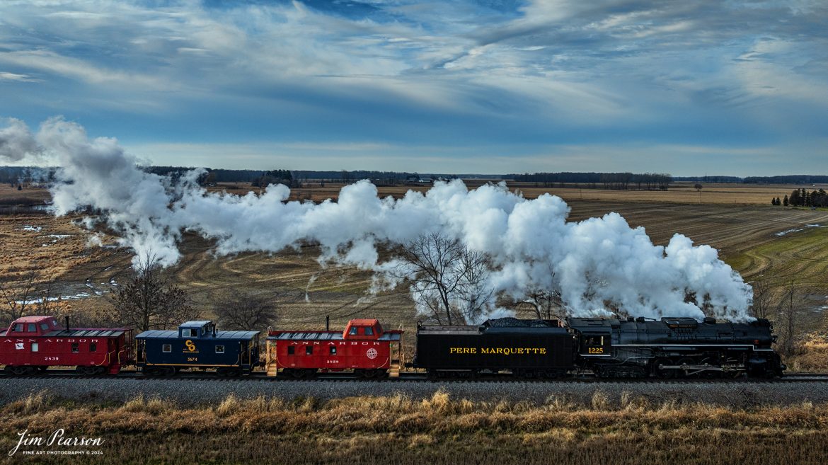 Steam Railroading Institute’s Pere Marquette 1225 makes its way through the Michigan countryside, as they run one of their last North Pole Express passenger trains for the 2024 season between Owosso and to the Village of Ashley, Michigan, for their Ashley Country Christmas, on December 16th, 2023. 

According to their website, Pere Marquette 1225, the largest and most impressive piece in the Steam Railroading Institute’s collection, is one of the largest operating steam locomotives in Michigan. The 1225 was built in October of 1941 by the Lima Locomotive Works in Lima, Ohio for the Pere Marquette Railway. It’s part of the National Register of Historic Structures and is renowned for its role in the 2004 Warner Brothers Christmas Classic, THE POLAR EXPRESS™. 1225’s blueprints were used as the prototype for the locomotive image as well as its sounds to bring the train in the animated film to life!

Tech Info: DJI Mavic 3 Classic Drone, RAW, 22mm, f/2.8, 1/2000, ISO 140.

#railroad #railroads #train #trains #bestphoto #railroadengines #picturesoftrains #picturesofrailway #bestphotograph #photographyoftrains #trainphotography #JimPearsonPhotography #steamtrains #trending