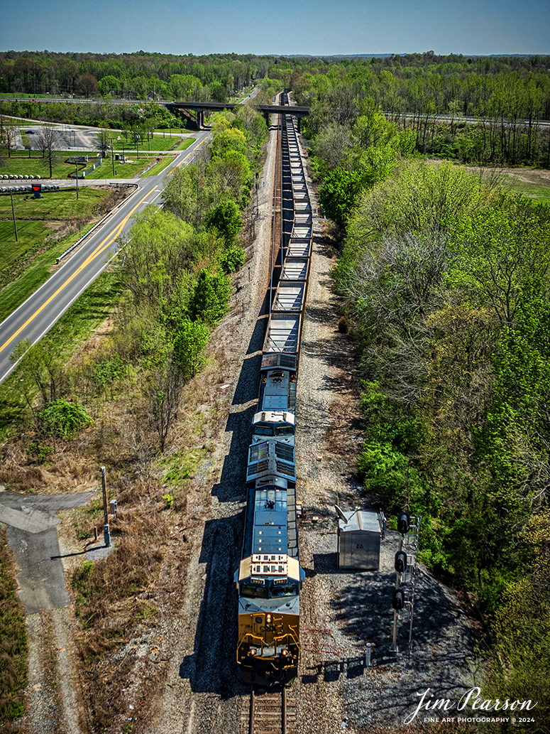 Northbound empty coal train E402 pulls out of track 1 at Oak Hill, just south of Mortons Gap, Kentucky on April 13th, 2024, on the CSX Henderson Subdivision.

Tech Info: DJI Mavic 3 Classic Drone, RAW, 22mm, f/8, 1/1600, ISO 110.

#trainphotography #railroadphotography #trains #railways #jimpearsonphotography #trainphotographer #railroadphotographer #dronephoto #trainsfromadrone #CSX