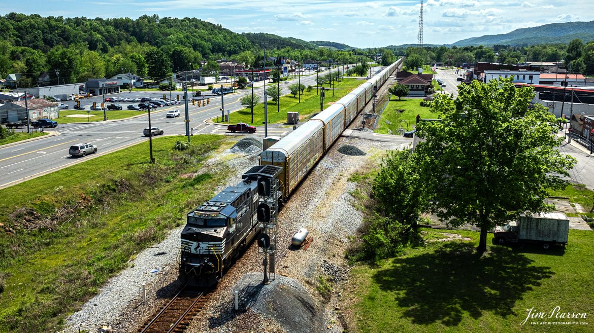 Norfolk Southern 4199 leads a northbound autorack train on the NS CNO&TP Third District as they pass the old depot in downtown Spring City, Tennessee on April 28th, 2024.

According to https://theclio.com website: The restored railroad depot was built In 1900 by the Queen and Crescent Railroad Company that extended out of Cincinnati Ohio built for the purposes of extending travel and commerce to the south. 

In addition to it's function of providing access to the southern areas of the United States, the Depot eventually became a museum that chronicled the story of a group of female rebels dubbed "The Rhea County Spartans." During the course of the Civil War these Women Served as spies for the Confederate Army. However they were eventually caught and as a result of their actions they were arrested and sent 54 miles to the Market Street in Chattanooga. It was there that they were forced to swear allegiance to the Union before being sent back home on foot.

Today it houses the Spring City History Museum.

Tech Info: DJI Mavic 3 Classic Drone, RAW, 24mm, f/2.8, 1/4000, ISO 160.

#trainphotography #railroadphotography #trains #railways #dronephotography #trainphotographer #railroadphotographer #jimpearsonphotography #trains #bnsf #mavic3classic #drones #trainsfromtheair #trainsfromadrone #NorfolkSouthern #TennesseeTrains #CNOTP