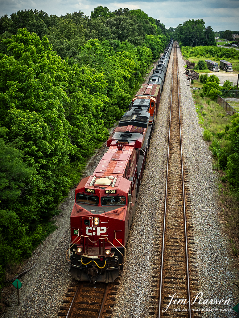 Canadian Pacific 8925 and BNSF 6749 lead CSX B647, a loaded ethanol train, headed southbound at Sebree, Kentucky on May 25th, 2024, on the CSX Henderson Subdivision.

Tech Info: DJI Mavic 3 Classic Drone, RAW, 22mm, f/8, 1/1000, ISO 140.

#trainphotography #railroadphotography #trains #railways #jimpearsonphotography #trainphotographer #railroadphotographer #dronephoto #trainsfromadrone #CSX