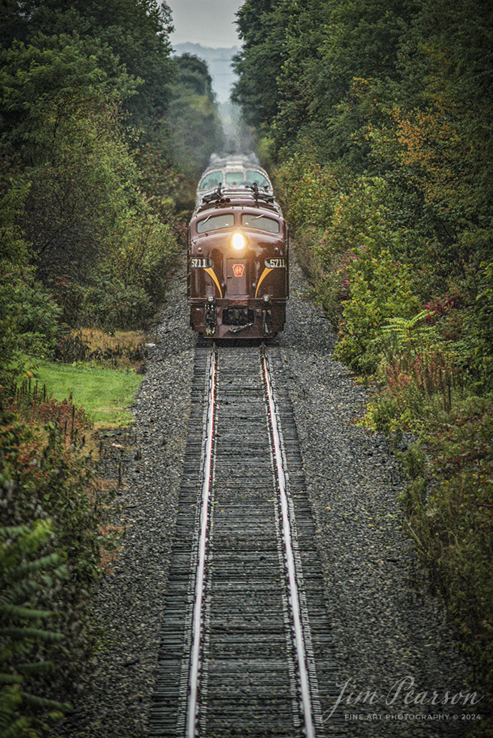 July 31, 2004- Blast from The Past - A pair of E8s, with 5711 leading, in beautiful Pennsylvania RR maroon and gold paint pulled a private car passenger train between Philadelphia and Dennison, Ohio during the Dennison Railroad Museum's 2004 Railfest. Here it is just East of Morgan Run headed toward Dennison. 

The event was in cooperation with the Ohio Central Railroad, as the museum celebrated its 15th Anniversary. It was billed as the largest railroad heritage event of 2004. 

It ran from July 30 to August 1, 2004. Many of the locomotives featured during the event were owned by the Ohio Central Railroad. The Ohio Central at that time provided full-time freight railroad services and offered passenger excursions powered by vintage equipment. Not sure if this is still the case or not.
Tech Info: Nikon D100, Nikon 300mm @ 300mm, f/4, 1/1000, ISO 400.

#trainphotography #railroadphotography #trains #railways #trainphotographer #railroadphotographer #jimpearsonphotography #OhioCentralRailroad #ohiotrains