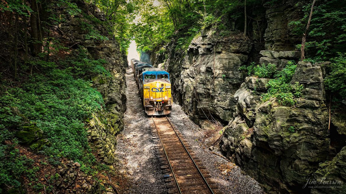 CSXT 507 leads loaded coal train C305 as it heads south through the Red River Cut at Adams, Tennessee on the CSX Henderson Subdivision on July 31st, 2024. 

This is a still frame grab I did from a video I shot of the train making its way through the cut which will be featured in next Saturday's Edited video, and I must say I’m really pleased with the results of doing this frame grab. Not that I’ll be doing this as a norm, but there’s times when I want to shoot both, and this gives me a way to accomplish this by just shooting 4k video.

Tech Info: DJI Mavic 3 Classic Drone, MP4 Video, 24mm, Tiff Frame Grab from 4K Video.

#trainphotography #railroadphotography #trains #railways #dronephotography #trainphotographer #railroadphotographer #jimpearsonphotography #trains #csxt #mavic3classic #drones #trainsfromtheair #trainsfromadrone