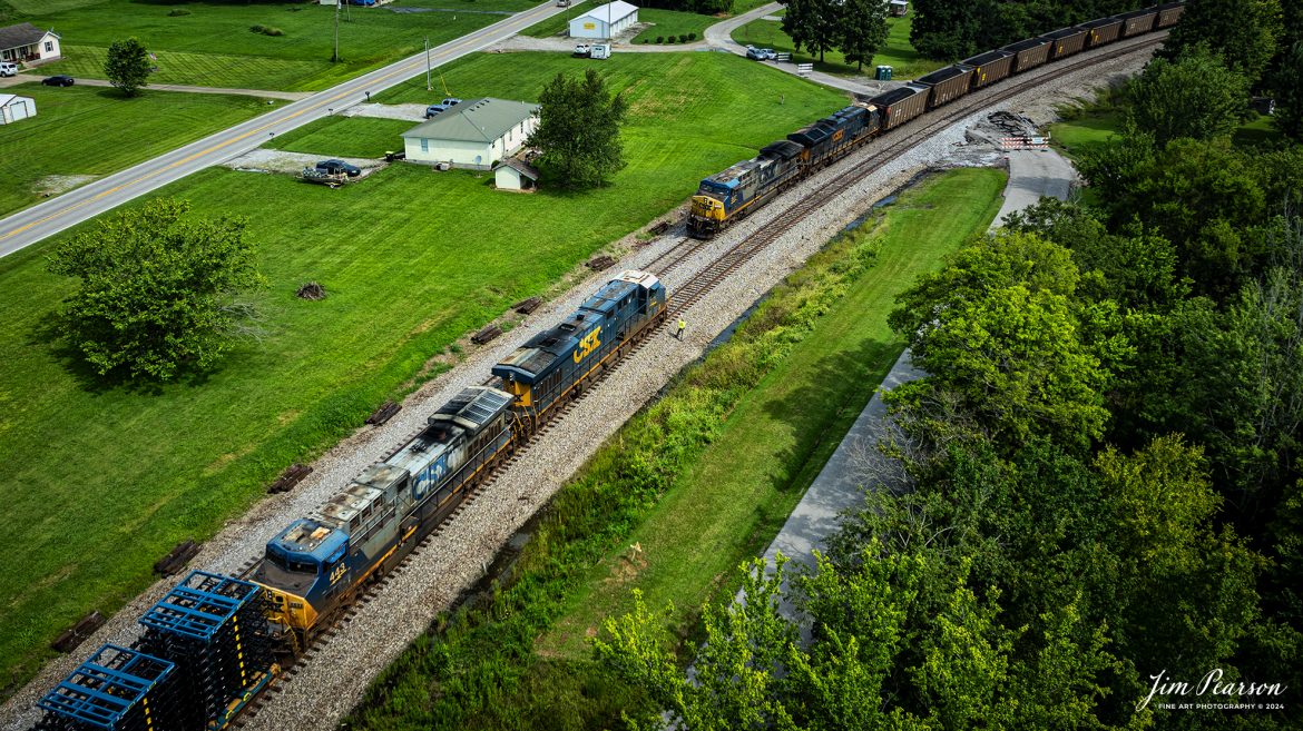 The conductor on G376 does a roll-by inspection on a southbound loaded coal train C305 as they meet at the north end of the siding in Kelly, Kentucky on July 31st, 2024, on the CSX Henderson Subdivision.

In addition to their empty grain loads they stopped and picked up a long string of truck frames at Hopkinsville for Toyota up in Indiana. Normally they are picked up by M512 but ended up on this empty grain train today.

Tech Info: DJI Mavic 3 Classic Drone, RAW, 22mm, f/2.8, 1/800, ISO 100.

#railroad #railroads #train #trains #bestphoto #railroadengines #picturesoftrains #picturesofrailway #bestphotograph #photographyoftrains #trainphotography #JimPearsonPhotography #trendingphoto #csxt #trainsfromadrone