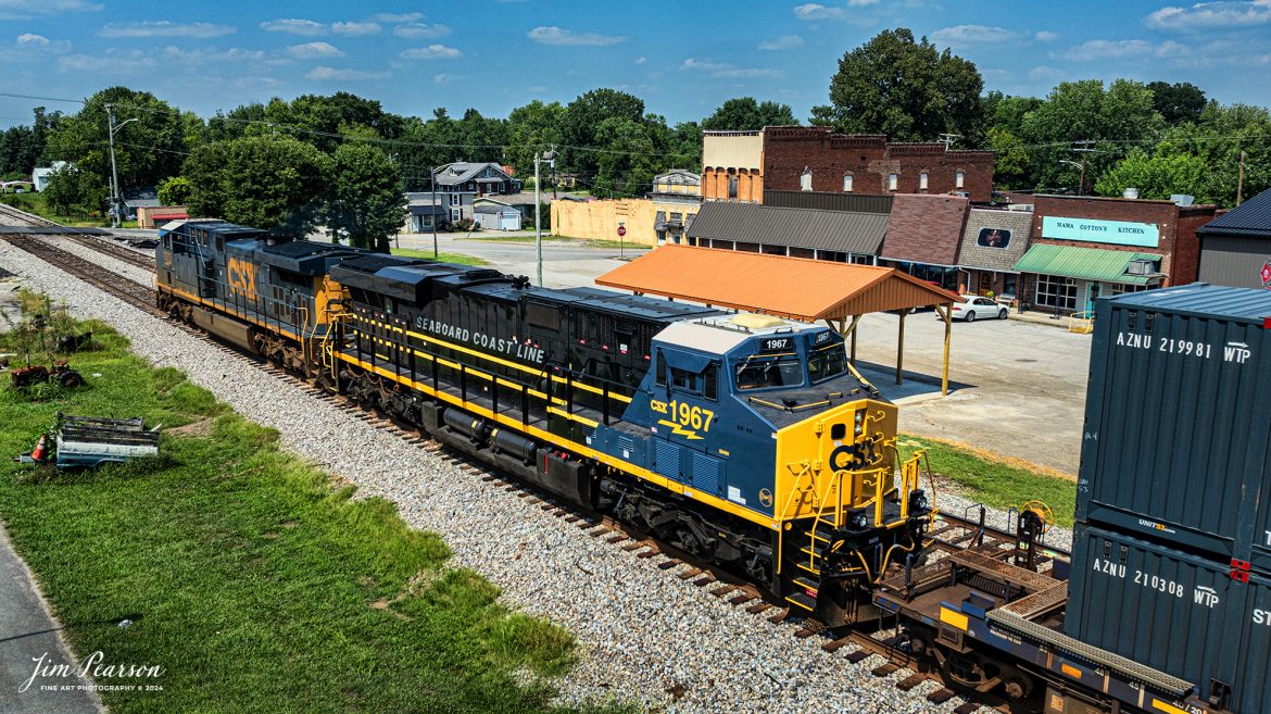 According to a CSX Press Release: May 23, 2024 - CSX Transportation has launched its newest heritage locomotive, paying tribute to the Seaboard Coast Line Railroad (SCL). This latest addition is part of CSX's ongoing initiative to honor its historical roots while paving the way for the future of railroading in America.

The Seaboard Coast Line Railroad (SCL) was a prominent rail line that operated in the southeastern United States from 1967 until 1983. SCL emerged from the merger of the Seaboard Air Line Railroad and the Atlantic Coast Line Railroad. In 1986, SCL became part of CSX through a series of mergers and acquisitions that formed one of the largest Class I railroads in North America.

“When SCL was an active railroad, it was the eighth largest railroad with almost 10,000 miles across the southern United States,” explained CSX Carman Painter Jason Merritt, one of the team members who worked on the project. “In fact, the ‘S’ in CSX actually stands for Seaboard.”

CSX has been dedicated to preserving the legacy of the railroads that form its foundation by creating heritage locomotives. These locomotives are meticulously designed and crafted at the company's locomotive shop in Waycross, Georgia. Each piece represents a significant chapter in the rich history of American railroading.

CSX Carman Painter Tim Music said, "This project was especially meaningful to me because both my late brother and sister retired from CSX and experienced the Seaboard Coastline years. Growing up just 100 feet from the railroad tracks, I vividly recall the black and yellow SCL paint scheme passing by every day."

The new SCL heritage locomotive joins a growing fleet of locomotives that celebrate the diverse and storied past of CSX. The unit is the fourteenth in the series produced by the railroad. By honoring these historic lines, CSX not only pays homage to its origins but also inspires a deep appreciation for the role railroads have played in shaping the nation's infrastructure and economy.

Tech Info: DJI Mavic 3 Classic Drone, RAW, 22mm, f/2.8, 1/2000, ISO 100.

#railroad #railroads #train, #trains #railway #railway #steamtrains #railtransport #railroadengines #picturesoftrains #picturesofrailways #besttrainphotograph #bestphoto #photographyoftrains #steamtrainphotography #bestsoldpicture #JimPearsonPhotography #csxheritagelocomotive