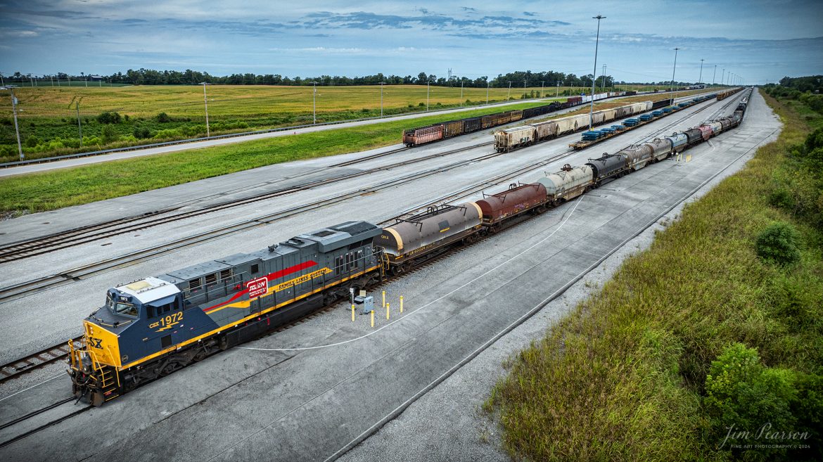 CSX M513 heads south out of Casky Yard as it continues it's run south from Hopkinsville, Kentucky, with CSX Heritage Unit L&N 1972 Family Lines System Leading, on August 16th, 2024, on the Henderson Subdivision.

According to CSXT: Our fleet of heritage locomotives is growing again as we unveil CSX Locomotive 1972, a tribute to the Family Lines System! The #ONECSX team in Waycross, GA recreated this unit to celebrate the special time from 1972-1982 when the Seaboard Coast Line, Clinchfield and L&N railroads were marketed as one. Eventually merging to become the Seaboard System Railroad, and ultimately the CSX we know today, the Family Lines System represents an integral part of our railroad’s rich history.

The CSX heritage series is reinforcing employee pride in the history of the railroad that continues to move the nation’s economy with safe, reliable, and sustainable rail-based transportation services.

Tech Info: DJI Mavic 3 Classic Drone, RAW, 22mm, f/2.8, 1/2000, ISO 130.

#railroad #railroads #train #trains #bestphoto #railroadengines #picturesoftrains #picturesofrailway #bestphotograph #photographyoftrains #trainphotography #JimPearsonPhotography #trendingphoto