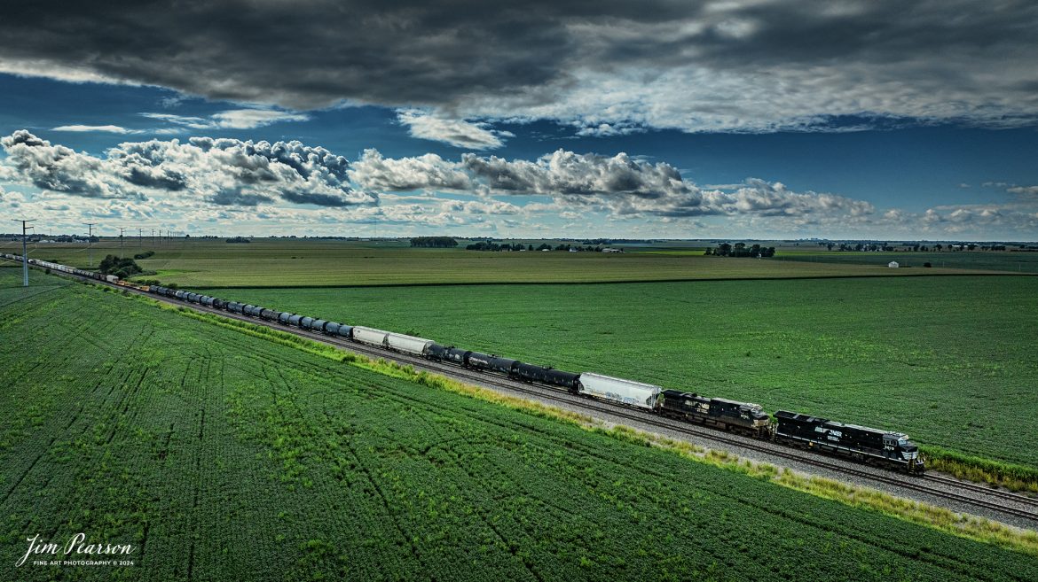 Norfolk Southern 3619 and 9750 lead NS 148  mixed freight as it stretches across the southern Illinois landscape as it heads east outside of Sidney, Illinois under cloudy weather, on the NS Lafayette District on August 17th, 2024. 

Tech Info: DJI Mavic 3 Classic Drone, RAW, 22mm, f/2.8, 1/3200, ISO 210.

#trainphotography #railroadphotography #trains #railways #trainphotographer #railroadphotographer #jimpearsonphotography #NorfolkSouthern #IllinoisRailroads