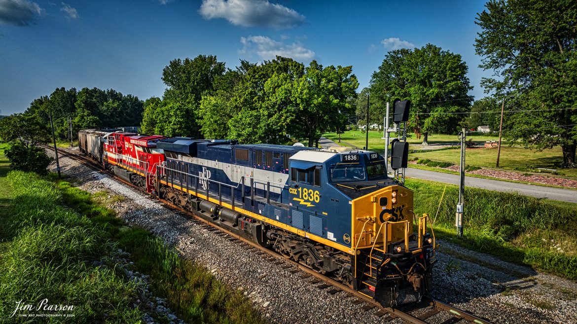 CSX Richmond, Fredericksburg & Potomac Heritage Unit (RF&P) 1836 and CSX 911 Honoring first Responders were paired up on August 19th as they led CSX M513 south at Mortons Gap, Kentucky on the CSX Henderson Subdivision.

According to a CSX Press Release: February 15, 2024 - CSX has once again demonstrated its commitment to honoring the legacy of American railroads by launching its latest heritage locomotive, the RF&P 1836. This addition to the heritage fleet represents a significant milestone for the company, marking the tenth locomotive in this distinguished series.

This new locomotive, numbered 1836, pays tribute to the Richmond, Fredericksburg & Potomac (RF&P) Railroad's founding year. The RF&P 1836 is a testament to CSX's dedication to preserving and celebrating railroad history, as well as its commitment to innovation and modernization.

“Heritage goes far beyond the paint, the font and the schemes,” said Adam Oakley, CSX Supply Chain Manager, who assisted with the project. “Heritage is the people who make these railroads.”

The RF&P 1836 made its debut after being released from the CSX Waycross paint shops. With a modern business look up front and a fun heritage look in the back, the CSX heritage scheme has been described as a "mullet" in the world of locomotives.

The launch of the RF&P 1836 follows a series of similar releases by CSX, each paying homage to a different railroad that has made significant contributions to the industry. The company's heritage program continues to be a way for CSX to honor the past while also looking towards the future.

Tech Info: DJI Mavic 3 Classic Drone, RAW, 22mm, f/2.8, 1/1600, ISO 110.

#railroad #railroads #train #trains #bestphoto #railroadengines #picturesoftrains #picturesofrailway #bestphotograph #photographyoftrains #trainphotography #JimPearsonPhotography #trendingphoto #csxheritagelocomotive