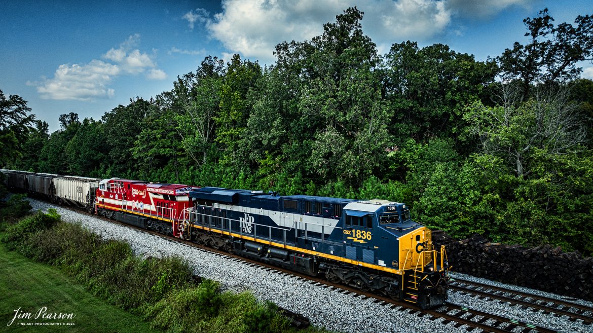 CSX Richmond, Fredericksburg & Potomac Heritage Unit (RF&P) 1836 and CSX 911 Honoring first Responders were paired up on August 19th as they led CSX M513 south at Slaughters, Kentucky on the CSX Henderson Subdivision.

According to a CSX Press Release: February 15, 2024 - CSX has once again demonstrated its commitment to honoring the legacy of American railroads by launching its latest heritage locomotive, the RF&P 1836. This addition to the heritage fleet represents a significant milestone for the company, marking the tenth locomotive in this distinguished series.

This new locomotive, numbered 1836, pays tribute to the Richmond, Fredericksburg & Potomac (RF&P) Railroad's founding year. The RF&P 1836 is a testament to CSX's dedication to preserving and celebrating railroad history, as well as its commitment to innovation and modernization.

“Heritage goes far beyond the paint, the font and the schemes,” said Adam Oakley, CSX Supply Chain Manager, who assisted with the project. “Heritage is the people who make these railroads.”

The RF&P 1836 made its debut after being released from the CSX Waycross paint shops. With a modern business look up front and a fun heritage look in the back, the CSX heritage scheme has been described as a "mullet" in the world of locomotives.

The launch of the RF&P 1836 follows a series of similar releases by CSX, each paying homage to a different railroad that has made significant contributions to the industry. The company's heritage program continues to be a way for CSX to honor the past while also looking towards the future.

Tech Info: DJI Mavic 3 Classic Drone, RAW, 22mm, f/2.8, 1/1600, ISO 250.

#railroad #railroads #train #trains #bestphoto #railroadengines #picturesoftrains #picturesofrailway #bestphotograph #photographyoftrains #trainphotography #JimPearsonPhotography #trendingphoto #csxheritagelocomotive