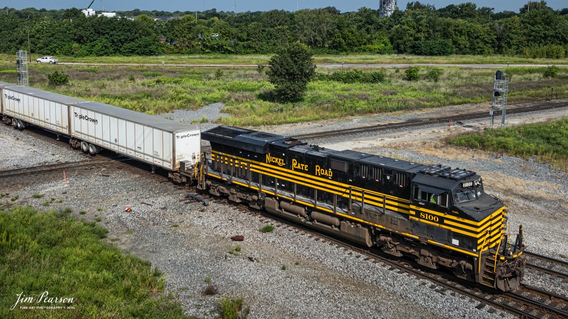 Norfolk Southern Nickel Plate Road Heritage Unit 8100 leads Triple Crown RoadRailer train NS 256 eastbound as it passes the over the WABIC Diamond at Decatur, Illinois on August 24th, 2024, as they head east on the NS Lafayette District. 

The NS RoadRailer trains are now a thing of the past as the last one ran on the 25th of August 2024, and the service has now been discontinued and the will transition fully to standard double-stack trains.

According to Wikipedia: A RoadRailer is a trailer or semi-trailer that can be hauled on roads by a tractor unit and then by way of a fifth wheel coupling, operate in a unit train on railway lines. The RoadRailer system allows trailers to be pulled by locomotives without the use of flatcars, instead attaching trailers directly to bogies.

Triple Crown, a subsidiary of Norfolk Southern Railway, remains a user of RoadRailer transportation as of 2022. However, on August 12th, 2024, they announced the last RoadRailer Trains would be running the weekend of August 24 and 25, 2024. The RoadRailer trains will be replaced temporarily with Trailer on Flat Car (TOFC) service before transitioning fully to a standard double-stack container trains.

Tech Info: DJI Mavic 3 Classic Drone, RAW, 22mm, f/2.8, 1/1600, ISO 100.

#trainphotography #railroadphotography #trains #railways #trainphotographer #railroadphotographer #jimpearsonphotography #NorfolkSouthern #IllinoisRailroads