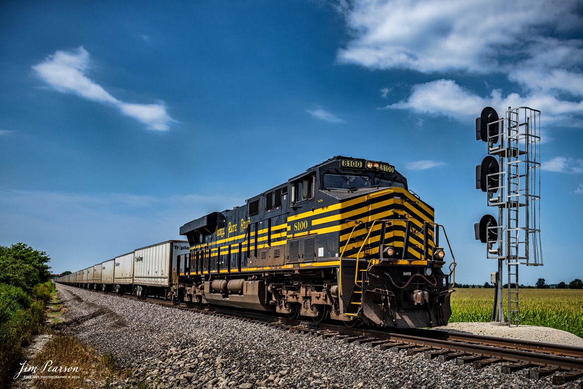 Norfolk Southern Nickel Plate Road Heritage Unit 8100 leads Triple Crown RoadRailer train NS 256 eastbound out of at Tolono, Illinois on August 24th, 2024, as they head east on the NS Lafayette District. 

The NS RoadRailer trains are now a thing of the past as the last one ran yesterday, 25th of August 2024, and the service has now been discontinued and the will transition fully to standard double-stack trains.

According to Wikipedia: A RoadRailer is a trailer or semi-trailer that can be hauled on roads by a tractor unit and then by way of a fifth wheel coupling, operate in a unit train on railway lines. The RoadRailer system allows trailers to be pulled by locomotives without the use of flatcars, instead attaching trailers directly to bogies.

Triple Crown, a subsidiary of Norfolk Southern Railway, remains a user of RoadRailer transportation as of 2022. However, on August 12th, 2024, they announced the last RoadRailer Trains would be running the weekend of August 24 and 25, 2024. The RoadRailer trains will be replaced temporarily with Trailer on Flat Car (TOFC) service before transitioning fully to a standard double-stack container trains.

Tech Info: Nikon D810, RAW, Nikon 24-70 @ 27mm, f/5, 1/1600, ISO 100.

#trainphotography #railroadphotography #trains #railways #trainphotographer #railroadphotographer #jimpearsonphotography #NorfolkSouthern #IllinoisRailroads