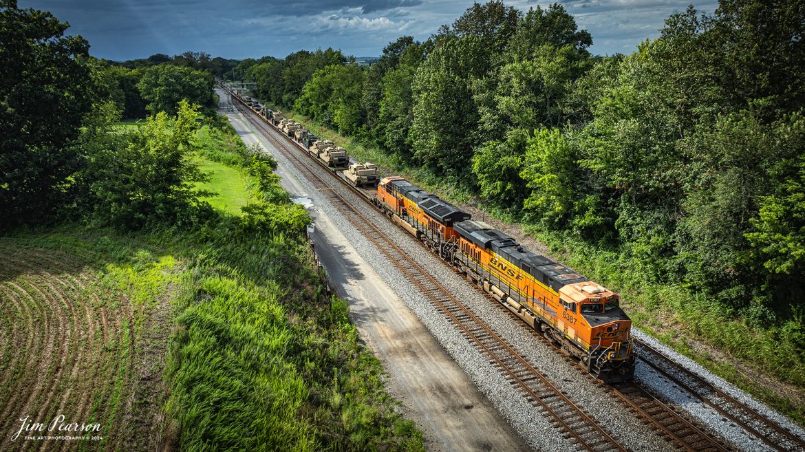 BNSF 6387 and 3947 lead CSX S577 as the crew backs a loaded military train onto the Ft. Campbell lead at from Casky yard at Hopkinsville, Ky, on the CSX Henderson Subdivision on July 9th, 2024.

Tech Info: DJI Mavic 3 Classic Drone, RAW, 22mm, f/2.8, 1/1250, ISO 110.

#railroad #railroads #train #trains #bestphoto #railroadengines #picturesoftrains #picturesofrailway #bestphotograph #photographyoftrains #trainphotography #JimPearsonPhotography #trendingphoto #militarytrains #stormyweather