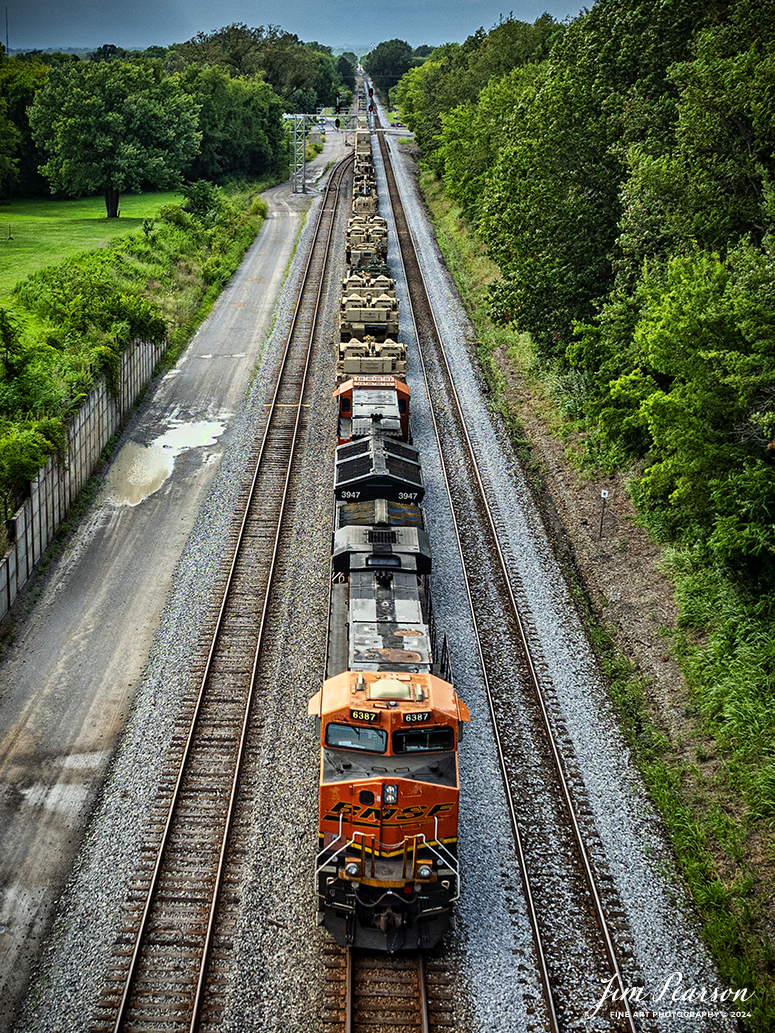 BNSF 6387 and 3947 lead CSX S577 as the crew backs a loaded military train onto the Ft. Campbell lead at from Casky yard at Hopkinsville, Ky, on the CSX Henderson Subdivision on July 9th, 2024.

Tech Info: DJI Mavic 3 Classic Drone, RAW, 22mm, f/2.8, 1/1000, ISO 140.

#railroad #railroads #train #trains #bestphoto #railroadengines #picturesoftrains #picturesofrailway #bestphotograph #photographyoftrains #trainphotography #JimPearsonPhotography #trendingphoto #militarytrains #stormyweather