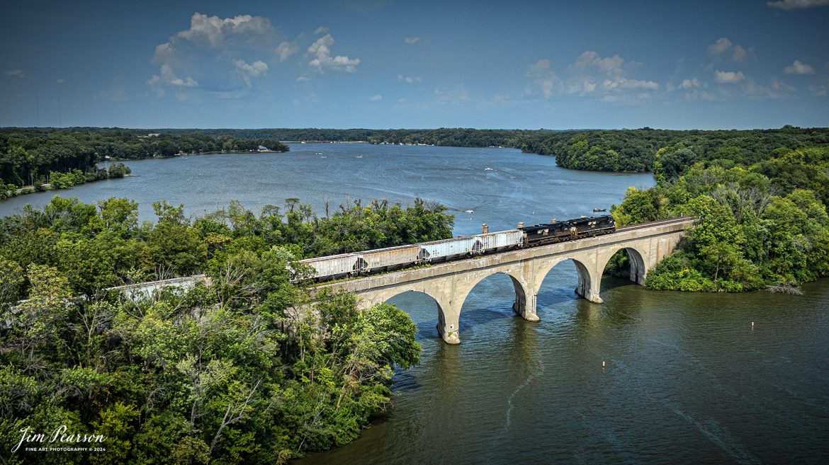 August 24th, 2024 - A eastbound Norfolk Southern Railway mixed freight makes its way across Decatur Lake, just outside Decatur, Illinois on the NS Lafyette District. From what I can find online the construction on the bridge was completed in 1907 by the Wabash railroad.

Tech Info: DJI Mavic 3 Classic Drone, RAW, 22mm, f/2.8, 1/2000, ISO 100.

#trainphotography #railroadphotography #trains #railways #trainphotographer #railroadphotographer #jimpearsonphotography #NorfolkSouthern #IllinoisRailroads