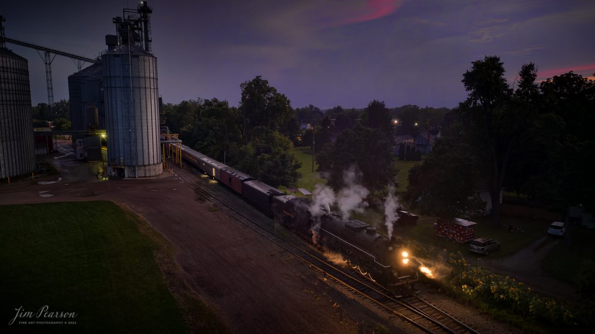 August 30th, 2024, Steam locomotive Nickel Plate 765 leads “The Limited” as they arrive at Reading, Michigan with a late evening passenger train run as part of Indiana Rail Experience’s Rolling Victory Weekend.

According to their website: Rolling Victory was a three-day living history event celebrating American military, railroad, and home front history featuring vintage train rides, World War II reenactors, battles, a big band orchestra, and an immersive and educational experience for all ages in Pleasant Lake, Indiana.

Tech Info: DJI Mavic 3 Classic Drone, RAW, 24mm, f/2.8, 1/20, ISO 800.

#railroad #railroads #train, #trains #railway #railway #steamtrains #railtransport #railroadengines #picturesoftrains #picturesofrailways #besttrainphotograph #bestphoto #photographyoftrains #bestsoldpicture #JimPearsonPhotography #steamtrains #nkp765 #passengertrains #trainsfromtheair #trainsfromadrone