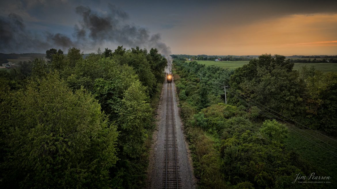 August 30th, 2024, Steam locomotive Nickel Plate 765 pulls “The Limited” through the countryside during the golden light of sunset as they on their way to Reading, Michigan as part of Indiana Rail Experience’s Rolling Victory Weekend.

According to their website: Rolling Victory was a three-day living history event celebrating American military, railroad, and home front history featuring vintage train rides, World War II reenactors, battles, a big band orchestra, and an immersive and educational experience for all ages in Pleasant Lake, Indiana.

Tech Info: DJI Mavic 3 Classic Drone, RAW, 24mm, f/2.8, 1/500, ISO 800.

#railroad #railroads #train, #trains #railway #railway #steamtrains #railtransport #railroadengines #picturesoftrains #picturesofrailways #besttrainphotograph #bestphoto #photographyoftrains #bestsoldpicture #JimPearsonPhotography #steamtrains #nkp765 #passengertrains #trainsfromtheair #trainsfromadrone