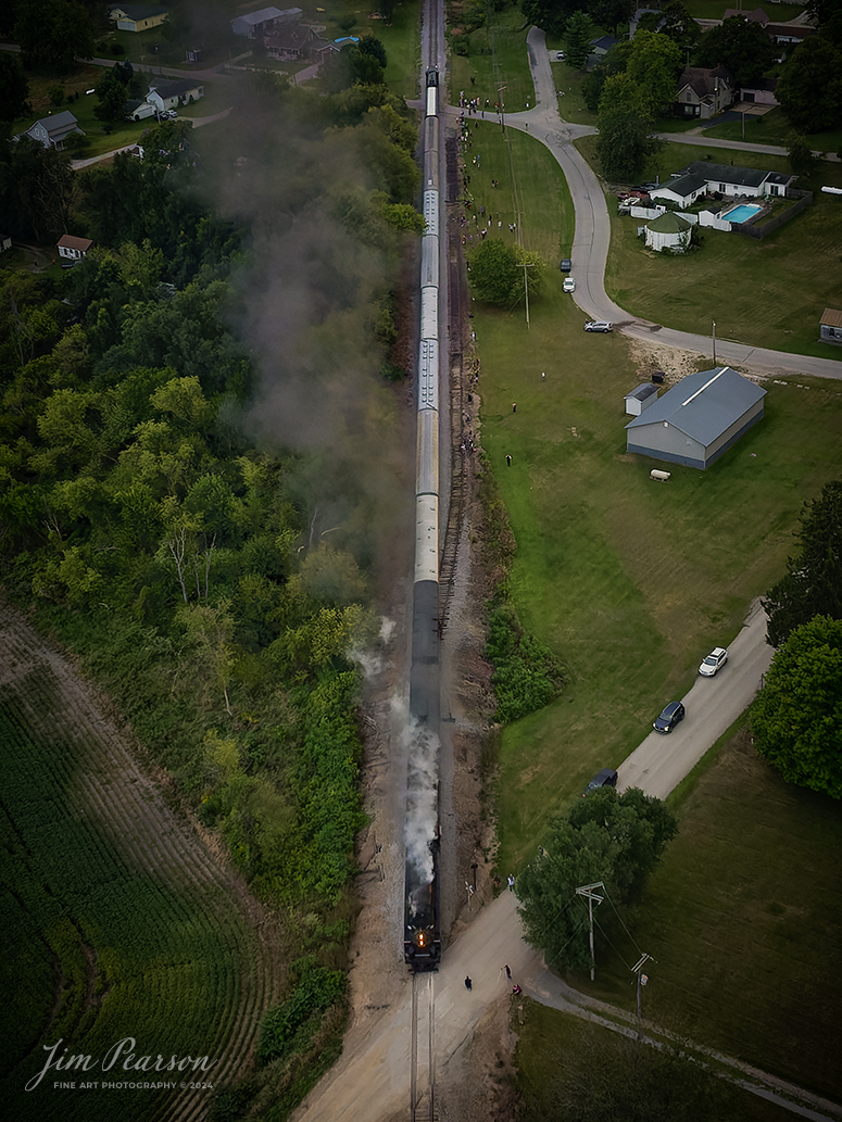 August 30th, 2024, Steam locomotive Nickel Plate 765 leads “The Limited” as they allow their passengers off the train at Ray, Indiana for a photo runby during a late evening passenger train run to Reading, Michigan, as part of Indiana Rail Experience’s Rolling Victory Weekend.

According to their website: Rolling Victory was a three-day living history event celebrating American military, railroad, and home front history featuring vintage train rides, World War II reenactors, battles, a big band orchestra, and an immersive and educational experience for all ages in Pleasant Lake, Indiana.

Tech Info: DJI Mavic 3 Classic Drone, RAW, 24mm, f/2.8, 1/500, ISO 800.

#railroad #railroads #train, #trains #railway #railway #steamtrains #railtransport #railroadengines #picturesoftrains #picturesofrailways #besttrainphotograph #bestphoto #photographyoftrains #bestsoldpicture #JimPearsonPhotography #steamtrains #nkp765 #passengertrains #trainsfromtheair #trainsfromadrone