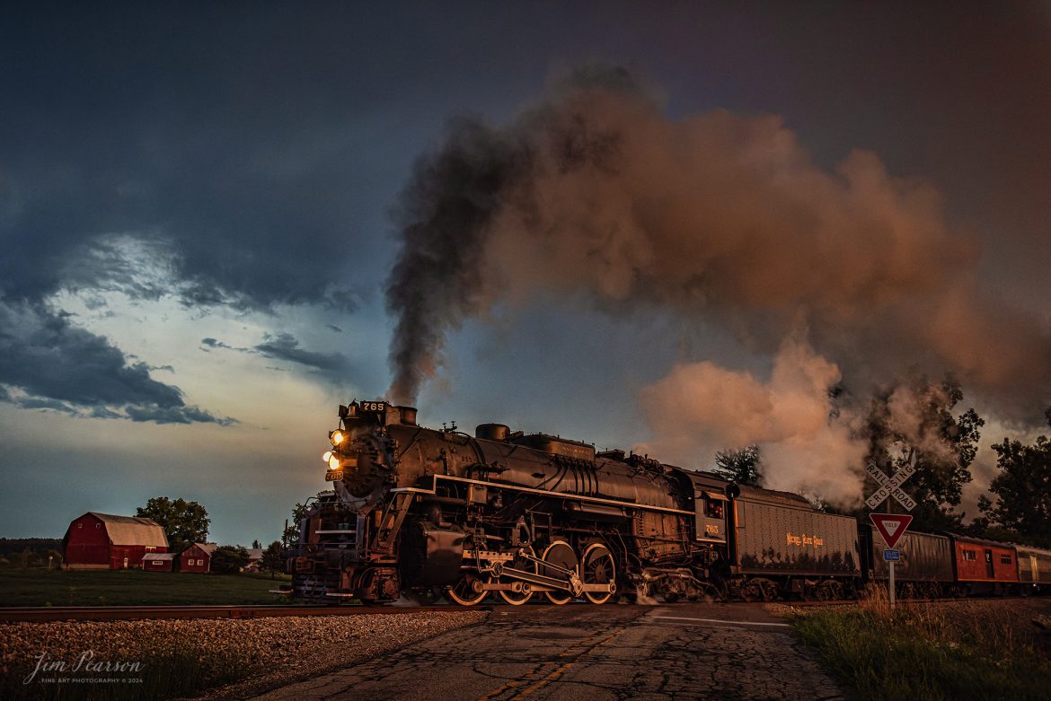 August 30th, 2024, Steam locomotive Nickel Plate 765 pulls “The Limited” through the countryside during the golden light of sunset as they on their way to Reading, Michigan as part of Indiana Rail Experience’s Rolling Victory Weekend,

According to their website: Rolling Victory was a three-day living history event celebrating American military, railroad, and home front history featuring vintage train rides, World War II reenactors, battles, a big band orchestra, and an immersive and educational experience for all ages in Pleasant Lake, Indiana.

Tech Info: DJI Mavic 3 Classic Drone, RAW, 24mm, f/2.8, 1/500, ISO 3200.

#railroad #railroads #train, #trains #railway #railway #steamtrains #railtransport #railroadengines #picturesoftrains #picturesofrailways #besttrainphotograph #bestphoto #photographyoftrains #bestsoldpicture #JimPearsonPhotography #steamtrains #nkp765 #passengertrains #trainsfromtheair #trainsfromadrone