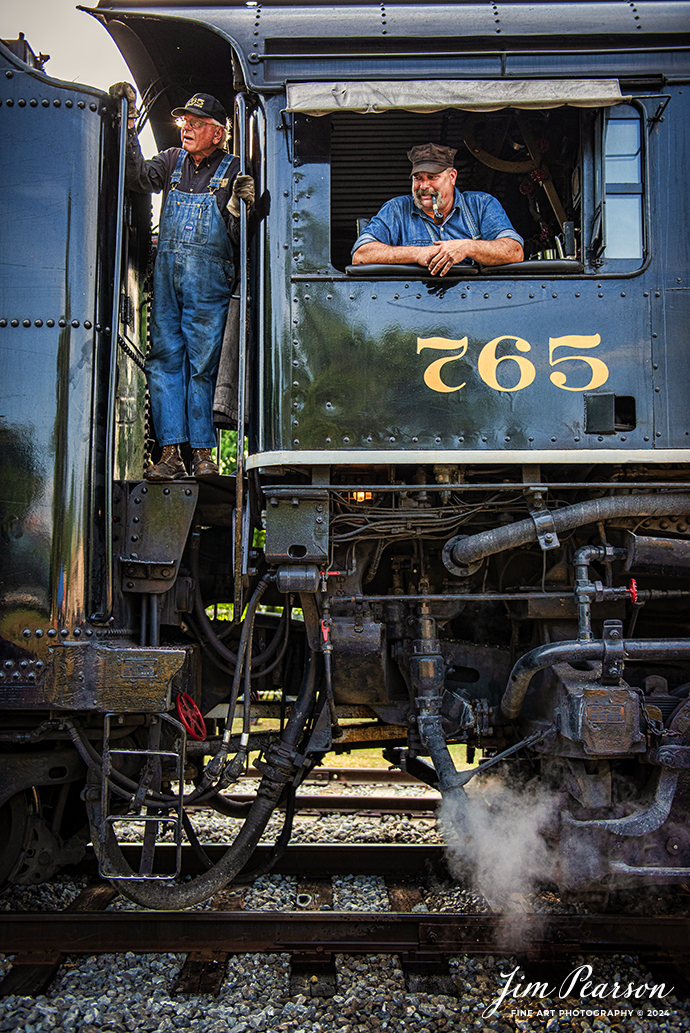 August 30th, 2024, Crew members on Steam locomotive Nickel Plate 765  “The Limited” wait to depart the depot at Pleasant Lake, Indiana before doing a late evening passenger train run to Reading, Michigan as part of Indiana Rail Experience’s Rolling Victory Weekend.

According to their website: Rolling Victory was a three-day living history event celebrating American military, railroad, and home front history featuring vintage train rides, World War II reenactors, battles, a big band orchestra, and an immersive and educational experience for all ages in Pleasant Lake, Indiana.

Tech Info: Nikon D810, RAW, Nikon 24-70 @ 35mm, f/2.8, 1/2000, ISO 1000.

#railroad #railroads #train, #trains #railway #railway #steamtrains #railtransport #railroadengines #picturesoftrains #picturesofrailways #besttrainphotograph #bestphoto #photographyoftrains #bestsoldpicture #JimPearsonPhotography #steamtrains #nkp765 #passengertrains