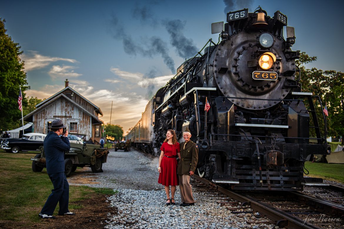 Reenactors pose for pictures next to Nickel Plate Steam Locomotive 765 during Indiana Rail Experience’s Rolling Victory Weekend on August 31st, 2024.

According to their website: Rolling Victory was a three-day living history event celebrating American military, railroad, and home front history featuring vintage train rides, World War II reenactors, battles, a big band orchestra, and an immersive and educational experience for all ages in Pleasant Lake, Indiana.

Tech Info: Nikon D810, RAW, Nikon 24-70 @ 40mm, f/2.8, 1/200, ISO 450.

#railroad #railroads #train, #trains #railway #railway #steamtrains #railtransport #railroadengines #picturesoftrains #picturesofrailways #besttrainphotograph #bestphoto #photographyoftrains #bestsoldpicture #JimPearsonPhotography #steamtrains #nkp765 #passengertrains