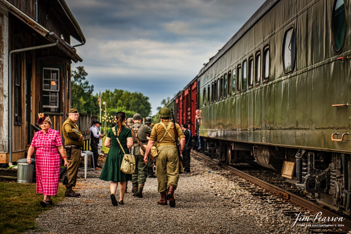 Reminiscent of a scene from the 1940’s we find reenactors are getting ready to board “The Battle Train” at Pleasant Lake, IN, on August 31st, 2024, where they were transported to the “battlefield” to take part in a mock battle as part of the Rolling Victory Weekend. This was the first time the event hosted battles during the weekend event and passengers and reenactors were transported via this train to participate and watch the battle.

According to their website: Rolling Victory was a three-day living history event celebrating American military, railroad, and home front history featuring vintage train rides, World War II reenactors, battles, a big band orchestra, and an immersive and educational experience for all ages in Pleasant Lake, Indiana.

Tech Info: Nikon D810, RAW, Nikon 24-70 @ 70mm, f/2.8, 1/500, ISO 64.

#railroad #railroads #train, #trains #railway #railway #steamtrains #railtransport #railroadengines #picturesoftrains #picturesofrailways #besttrainphotograph #bestphoto #photographyoftrains #bestsoldpicture #JimPearsonPhotography #steamtrains #nkp765 #passengertrains