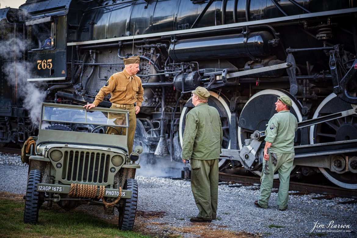 Military reenactors from left, Dave Stone, Tyler Kostyla,  and Ken Hoelscher pose for pictures with NKP 765 during the evening/night photo shoot at Pleasant Lake, IN, on August 31st, 2024, during the Rolling Victory Weekend. During World War II there were military crews that ran and maintained this locomotive, from what I’m told.

According to their website: Rolling Victory was a three-day living history event celebrating American military, railroad, and home front history featuring vintage train rides, World War II reenactors, battles, a big band orchestra, and an immersive and educational experience for all ages in Pleasant Lake, Indiana.

Tech Info: Nikon D810, RAW, Nikon 24-70 @ 62mm, f/2.8, 1/640, ISO 1100.

#railroad #railroads #train, #trains #railway #railway #steamtrains #railtransport #railroadengines #picturesoftrains #picturesofrailways #besttrainphotograph #bestphoto #photographyoftrains #bestsoldpicture #JimPearsonPhotography #steamtrains #nkp765 #passengertrains