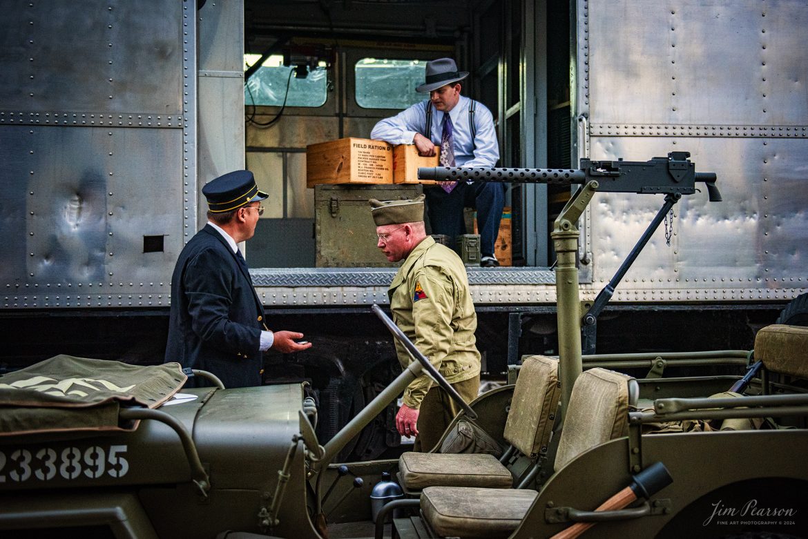 August 31st, 2024, Conductor, Brian Smith, talks to reenactors RJ Haught and Glenn Holland, as they pose for a evening/night photo shoot, during Indiana Rail Experience’s Rolling Victory Weekend.

According to their website: Rolling Victory was a three-day living history event celebrating American military, railroad, and home front history featuring vintage train rides, World War II reenactors, battles, a big band orchestra, and an immersive and educational experience for all ages in Pleasant Lake, Indiana.

Tech Info: Nikon D810, RAW, Nikon 24-70 @ 40mm, f/2.8, 1/200, ISO 2200.

#railroad #railroads #train, #trains #railway #railway #steamtrains #railtransport #railroadengines #picturesoftrains #picturesofrailways #besttrainphotograph #bestphoto #photographyoftrains #bestsoldpicture #JimPearsonPhotography #steamtrains #nkp765 #passengertrains