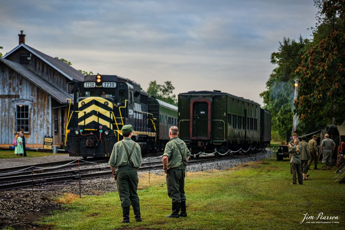 Indiana Northeastern 2230 prepares to transport “The Battle Train” from Pleasant Lake, IN, on August 31st, 2024, where they transported reenactors to the “battlefield” to take part in a mock battle as part of the Rolling Victory Weekend. This was the first time the event hosted battles during the weekend event and passengers and reenactors were moved via this train to participate and watch the battle.

According to their website: Rolling Victory was a three-day living history event celebrating American military, railroad, and home front history featuring vintage train rides, World War II reenactors, battles, a big band orchestra, and an immersive and educational experience for all ages in Pleasant Lake, Indiana.

Tech Info: Nikon D810, RAW, Nikon 24-70 @ 70mm, f/2.8, 1/500, ISO 100.

#railroad #railroads #train, #trains #railway #railway #steamtrains #railtransport #railroadengines #picturesoftrains #picturesofrailways #besttrainphotograph #bestphoto #photographyoftrains #bestsoldpicture #JimPearsonPhotography #steamtrains #nkp765 #passengertrains