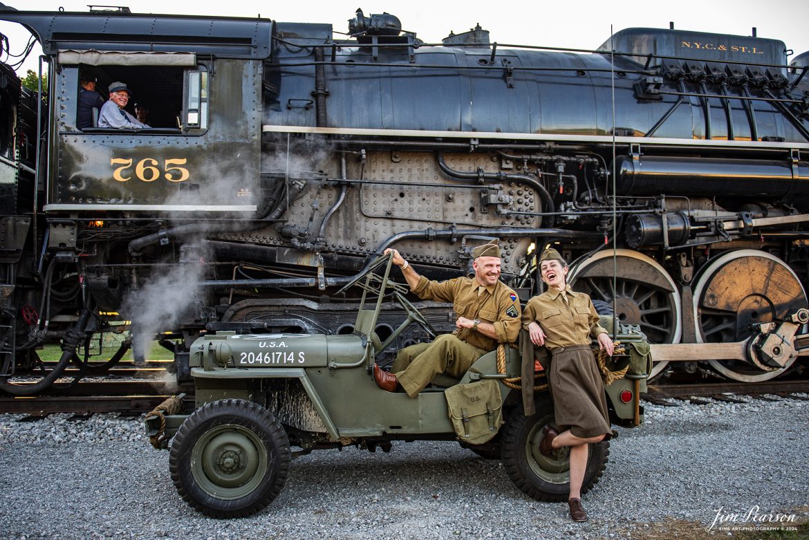 Military reenactors Sarah Crosby and Dave Stone with the 167th Signal Corp. enjoy a funny moment as Grant Geist, the engineer on NKP 765, laughs with them during the evening/night photo shoot at Pleasant Lake, IN, on August 31st, 2024, as part of the Rolling Victory Weekend.

According to their website: Rolling Victory was a three-day living history event celebrating American military, railroad, and home front history featuring vintage train rides, World War II reenactors, battles, a big band orchestra, and an immersive and educational experience for all ages in Pleasant Lake, Indiana.

Tech Info: Nikon D810, RAW, Nikon 24-70 @ 24mm, f/2.8, 1/640, ISO 720.

#railroad #railroads #train, #trains #railway #railway #steamtrains #railtransport #railroadengines #picturesoftrains #picturesofrailways #besttrainphotograph #bestphoto #photographyoftrains #bestsoldpicture #JimPearsonPhotography #steamtrains #nkp765 #passengertrains