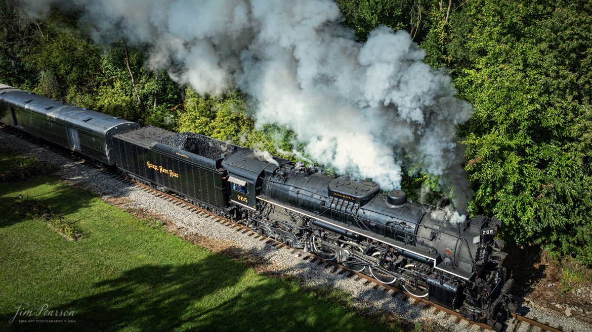 September 1st, 2024, Steam locomotive Nickel Plate 765 departs Pleasant Lake, Indiana as they head to Angola, Indiana for their first load of passengers during Indiana Rail Experience’s Rolling Victory Weekend.

According to their website: Rolling Victory was a three-day living history event celebrating American military, railroad, and home front history featuring vintage train rides, World War II reenactors, battles, a big band orchestra, and an immersive and educational experience for all ages in Pleasant Lake, Indiana.

Tech Info: DJI Mavic 3 Classic Drone, RAW, 24mm, f/2.8, 1/1000, ISO 100.

#railroad #railroads #train, #trains #railway #railway #steamtrains #railtransport #railroadengines #picturesoftrains #picturesofrailways #besttrainphotograph #bestphoto #photographyoftrains #bestsoldpicture #JimPearsonPhotography #steamtrains #nkp765 #passengertrains #trainsfromtheair #trainsfromadrone