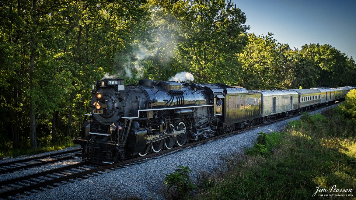 September 1st, 2024, Steam locomotive Nickel Plate 765 arrives at Angola, Indiana for their first load of passengers during Indiana Rail Experience’s Rolling Victory Weekend.

According to their website: Rolling Victory was a three-day living history event celebrating American military, railroad, and home front history featuring vintage train rides, World War II reenactors, battles, a big band orchestra, and an immersive and educational experience for all ages in Pleasant Lake, Indiana.

Tech Info: DJI Mavic 3 Classic Drone, RAW, 24mm, f/2.8, 1/1600, ISO 290.

#railroad #railroads #train, #trains #railway #railway #steamtrains #railtransport #railroadengines #picturesoftrains #picturesofrailways #besttrainphotograph #bestphoto #photographyoftrains #bestsoldpicture #JimPearsonPhotography #steamtrains #nkp765 #passengertrains #trainsfromtheair #trainsfromadrone