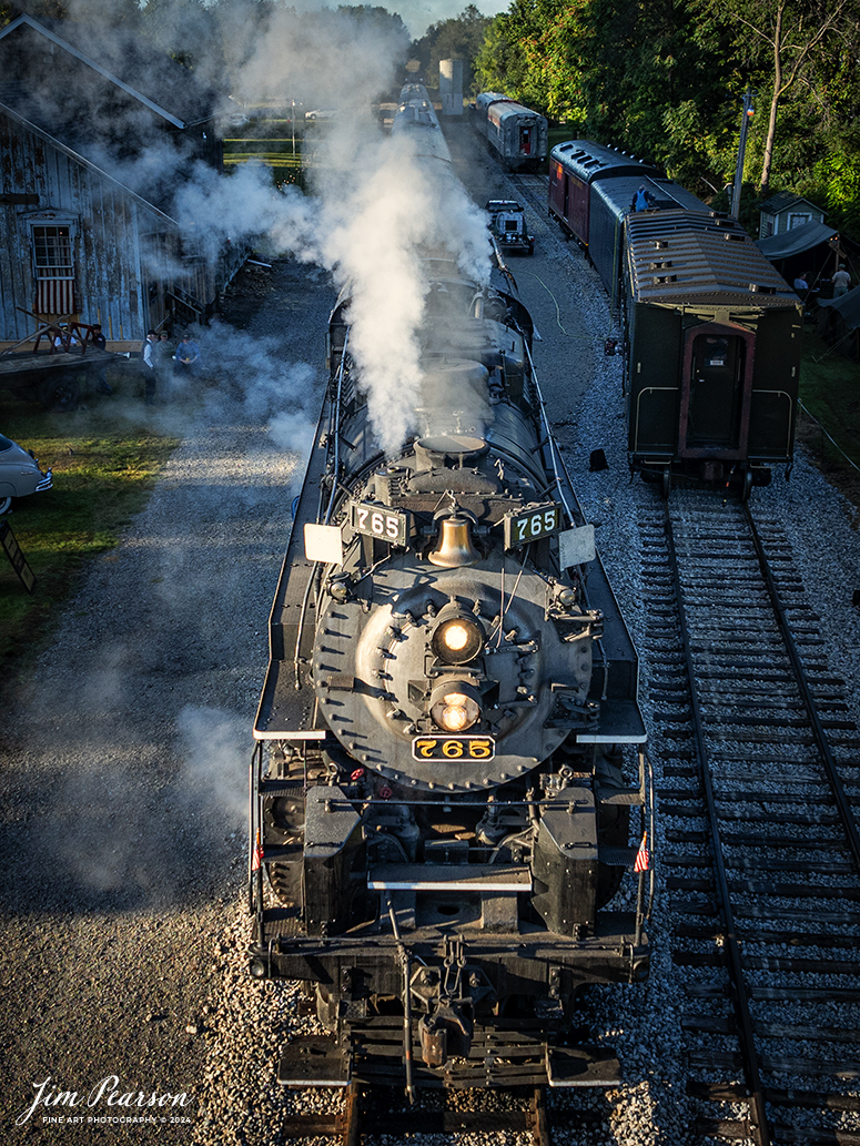 September 1st, 2024, Steam locomotive Nickel Plate 765 sits at the station in Pleasant Lake, Indiana as they prepare to head to Angola, Indiana for their first load of passengers during Indiana Rail Experience’s Rolling Victory Weekend.

According to their website: Rolling Victory was a three-day living history event celebrating American military, railroad, and home front history featuring vintage train rides, World War II reenactors, battles, a big band orchestra, and an immersive and educational experience for all ages in Pleasant Lake, Indiana.

Tech Info: DJI Mavic 3 Classic Drone, RAW, 24mm, f/2.8, 1/500, ISO 170.

#railroad #railroads #train, #trains #railway #railway #steamtrains #railtransport #railroadengines #picturesoftrains #picturesofrailways #besttrainphotograph #bestphoto #photographyoftrains #bestsoldpicture #JimPearsonPhotography #steamtrains #nkp765 #passengertrains #trainsfromtheair #trainsfromadrone