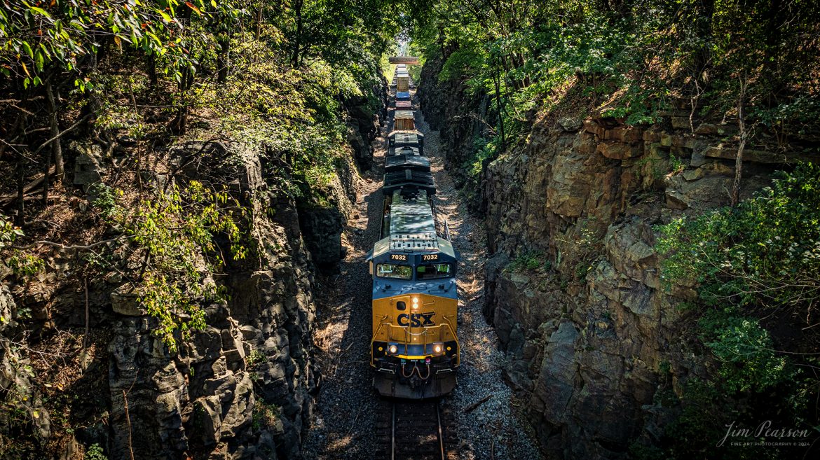 CSX Intermodal I128 exit the north end of the Red River Cut on September 6th, 2024 as it heads north with CSXT 7032 leading on the CSX Henderson Subdivision.

Tech Info: DJI Mavic 3 Classic Drone, RAW, 22mm, f/2.8, 1/240, ISO 150.

railroad, railroads train, trains, best photo. sold photo, railway, sold train photos, sold train pictures, freight trains, cargo trains, rail transport, railroad engines, pictures of trains, pictures of railways, best photograph, best photo, photography of trains, train photography, sold picture, best sold picture, CSX railroad, Kentucky trains, Jim Pearson Photography