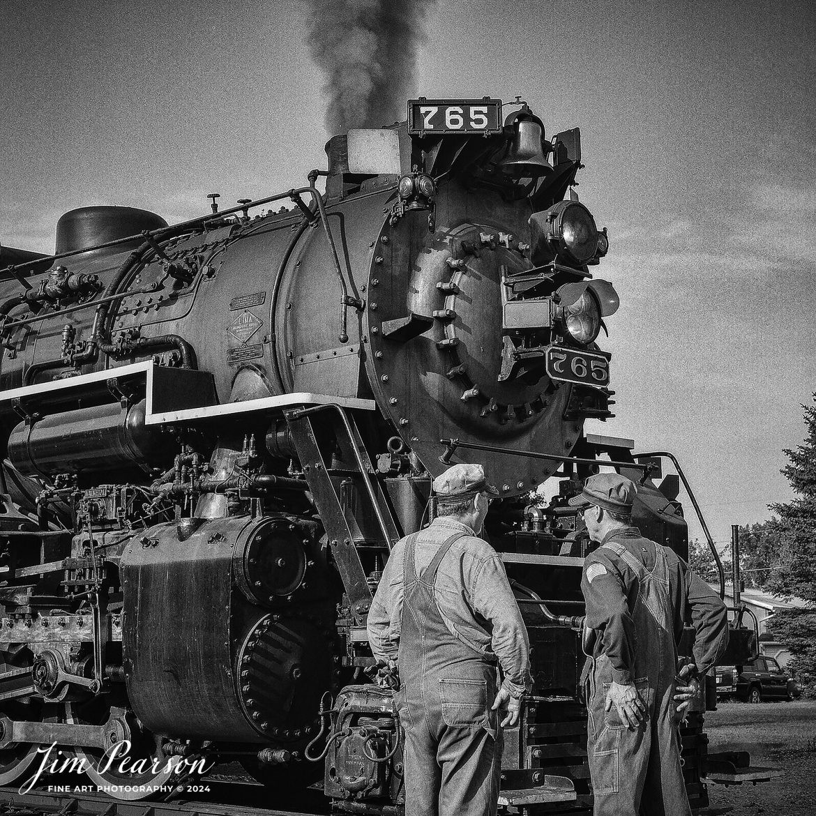 Analog Wednesday – I’ve added a like new Mamiya C330 Professional 2 ¼ square film camera to my camera bag and on Wednesday’s I’ll be sharing images I’ve shot with it. My Third shot is from September 1st, 2024, of Steam locomotive Nickel Plate 765 as engineers Aaron Sholley (765) on the right and Mark Tobin (368) talk at the nose of the engine as they wait to depart from Lake Pleasant, Indiana, for their first load of passengers during Indiana Rail Experience’s Rolling Victory Weekend.

I’m very pleased with my first roll that I shot through this camera and looking forward to shooting more! I hope you enjoy the images! I keep looking at the back trying to see my images after I shoot them though! Habits are hard to break! LOL

Tech Info: Mamiya C330 Professional, Ilford HP5 Film, Mamiya 80mm, f/4, 1/500, ISO 400.

#railroad #railroads #train, #trains #railway #railway #steamtrains #railtransport #railroadengines #picturesoftrains #picturesofrailways #besttrainphotograph #bestphoto #photographyoftrains #bestsoldpicture #JimPearsonPhotography #steamtrains #nkp765 #passengertrains #analogphotography